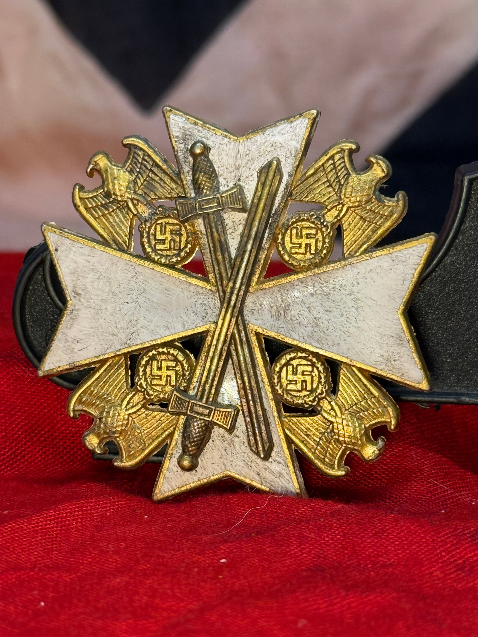 WWII German War Merit Cross First Class with Swords In 900 Silver L/50: This striking silvered multi-piece cross features blue enameled arms, crossed swords, and four national eagles surrounding the central cross. The reverse retains its original horizontal pin assembly a