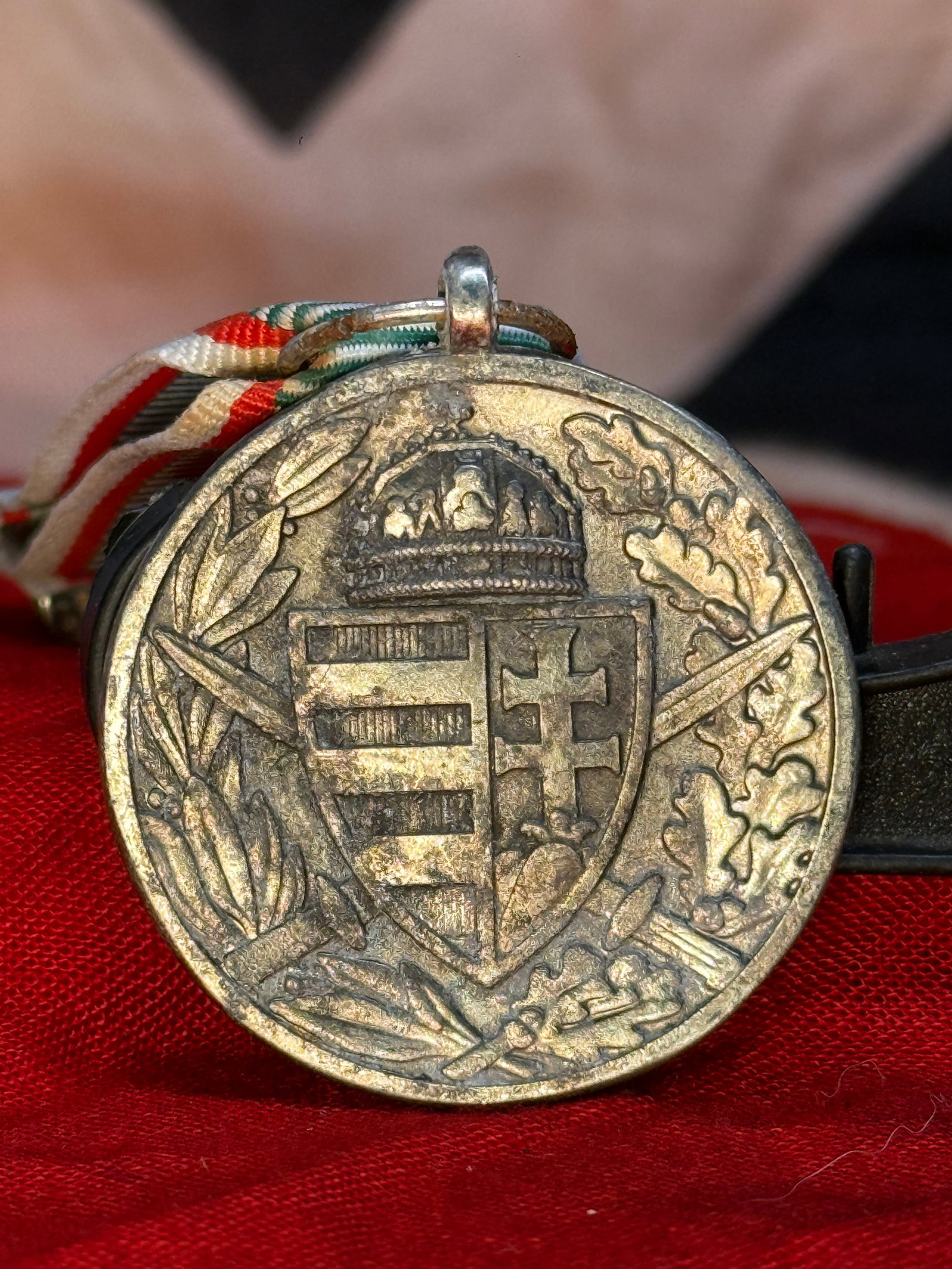 WWI Austro-Hungarian Pro Deo et Patria Medal: This circular silver-toned medal displays the inscription "PRO DEO ET PATRIA 1914–1918" surrounding a German-style steel helmet on the obverse, while the reverse features the crowned Austro-Hungaria
