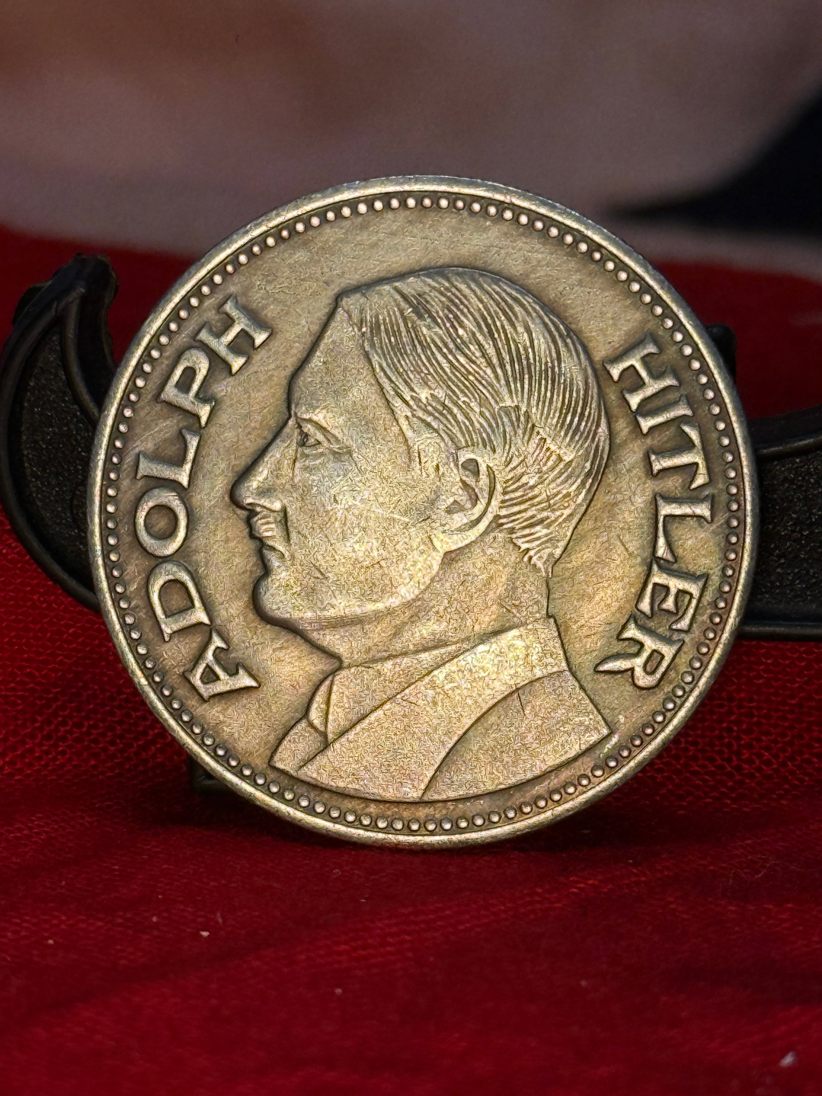 WW2 German Adolf Hitler Commemorative Medal: This commemorative medal features a left-facing portrait of Adolf Hitler surrounded by his name on the obverse, while the reverse displays the German national eagle above the inscription "DEUTSCHES RE