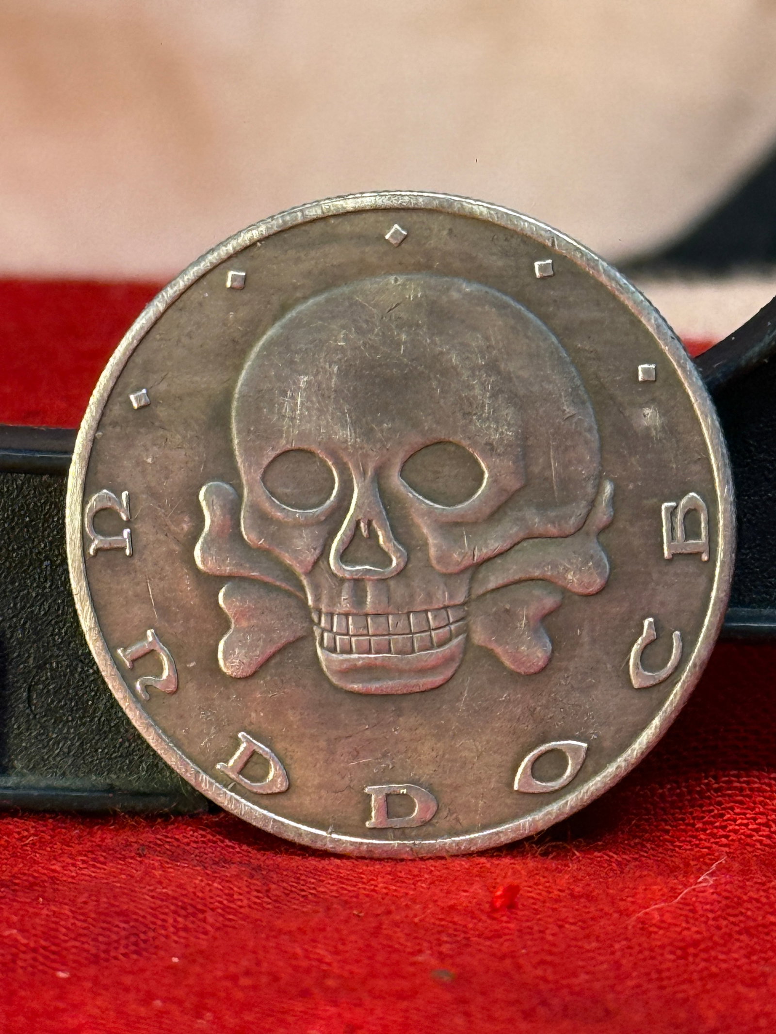 WWI German Freikorps Iron Division 1919 Commemorative Medal: This WWI German Freikorps Iron Division commemorative medal features the iconic Totenkopf skull and crossbones on the obverse with the inscription "Totenkopf," while the reverse displays a stylized sh