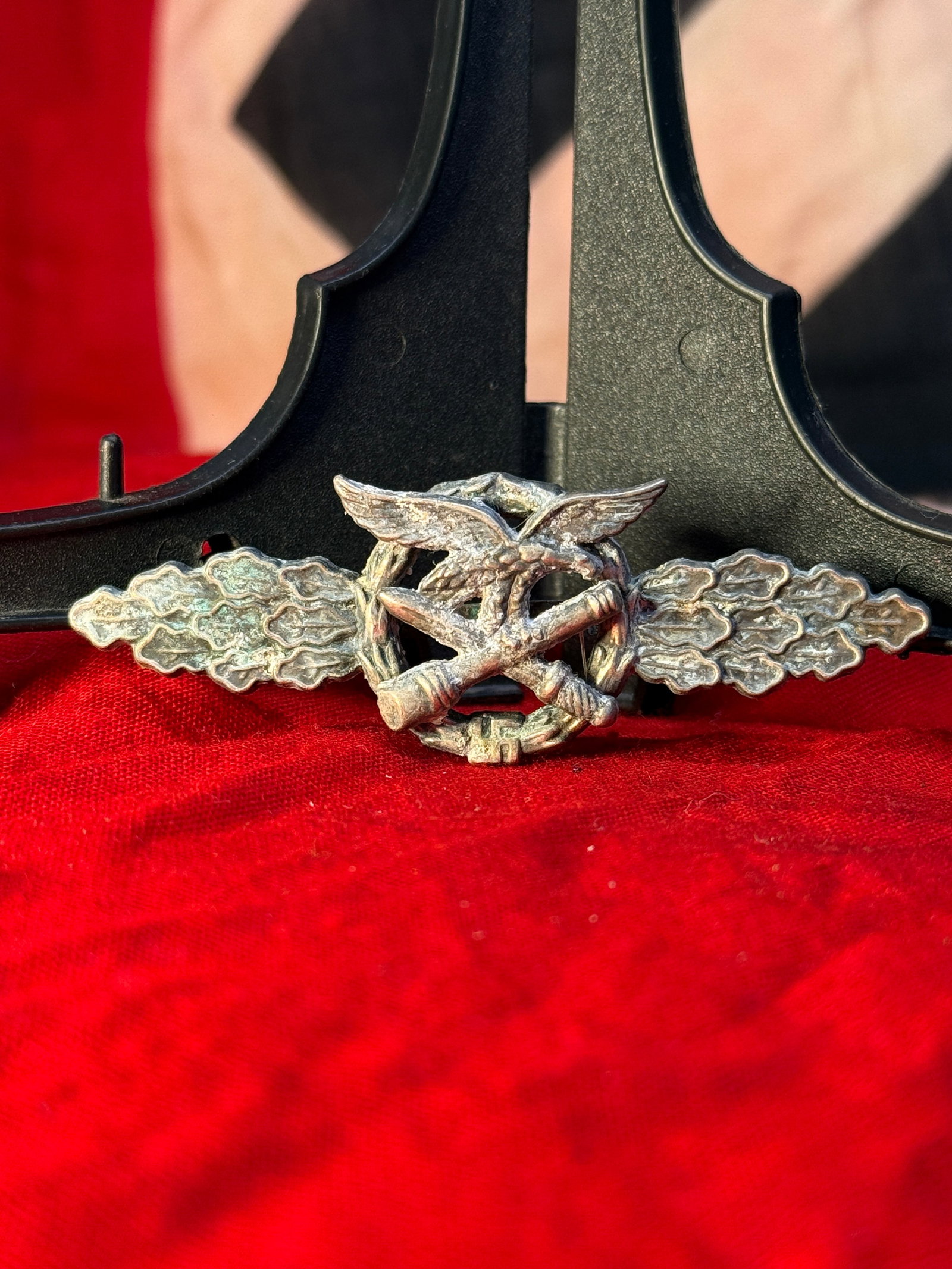 WWII German Luftwaffe Close Combat Clasp: This WWII German Luftwaffe Close Combat Clasp (Nahkampfspange der Luftwaffe) features a Luftwaffe eagle clutching a swastika positioned above crossed sword and lightning bolt devices, flanked by an el
