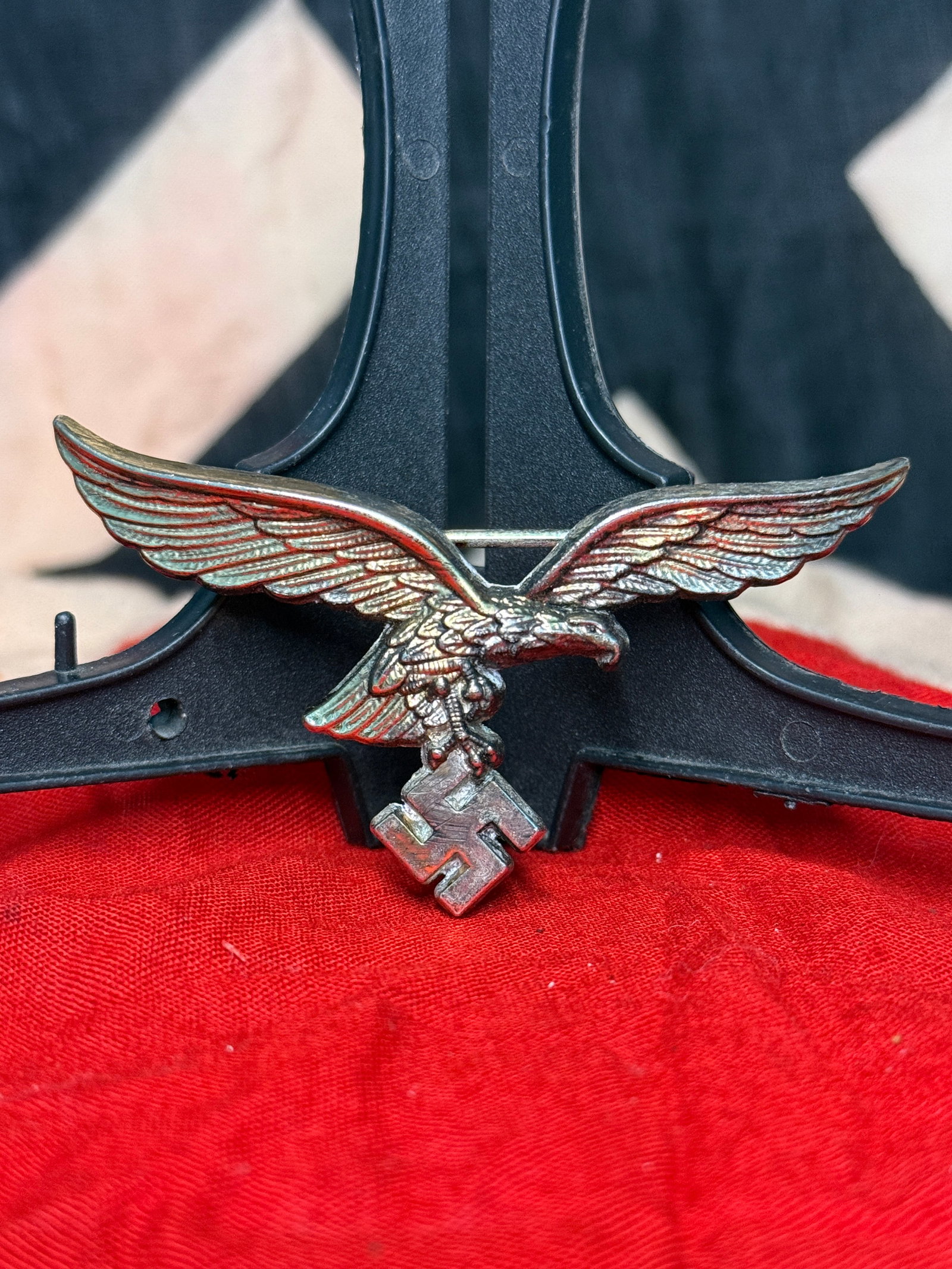 WWII German Luftwaffe Cap Eagle Military Insignia: This WWII German Luftwaffe Cap Eagle Military Insignia is constructed of silvered metal and depicts the outstretched Luftwaffe eagle grasping a swastika in its talons. Worn on German Air Force visor c