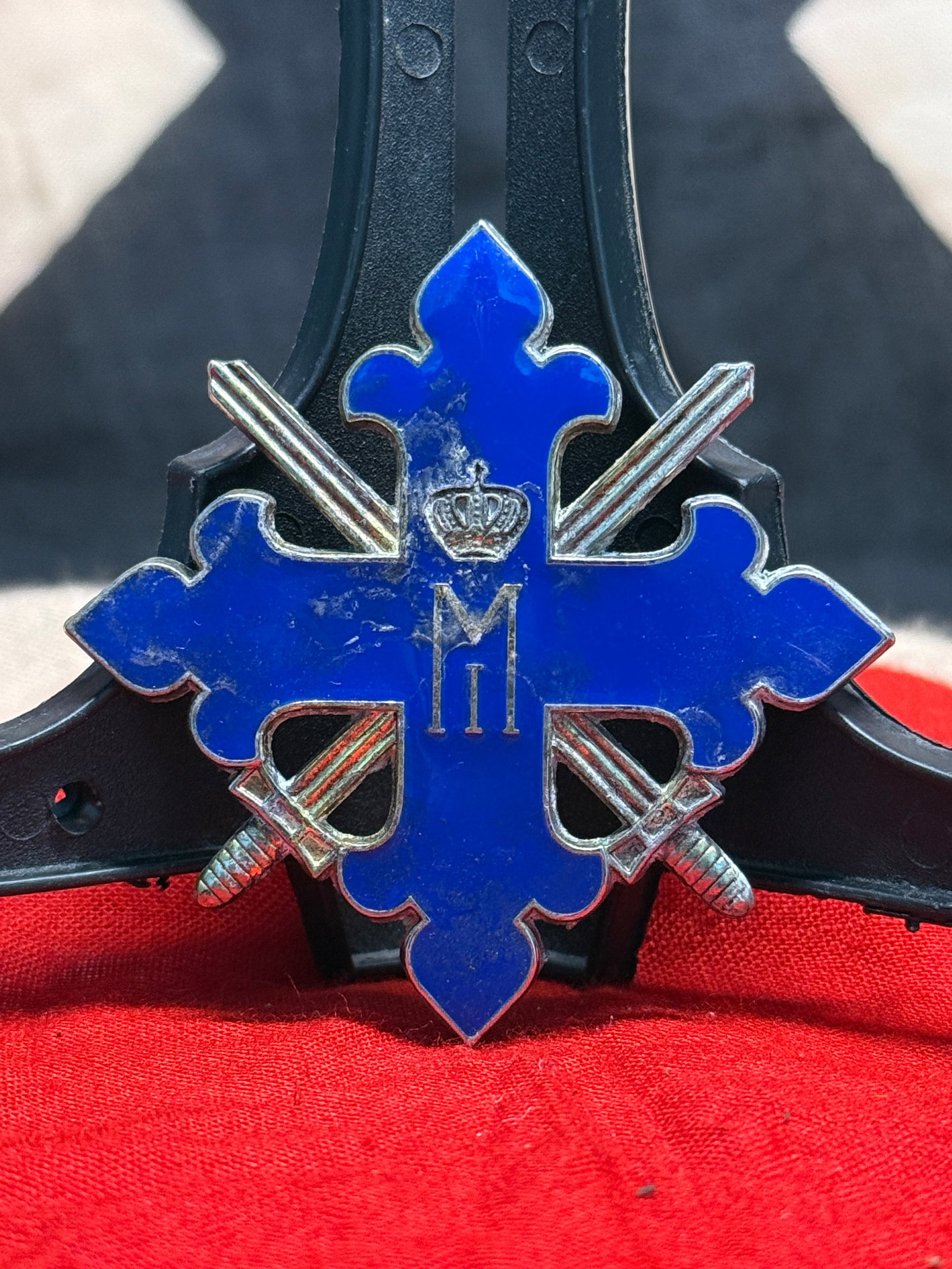 WWI Imperial German Military Merit Cross with Swords: This WWI Imperial German Military Merit Cross with Swords features a blue enameled cross bearing the crowned cipher of Kaiser Wilhelm II at its center, with crossed swords positioned between the arms 