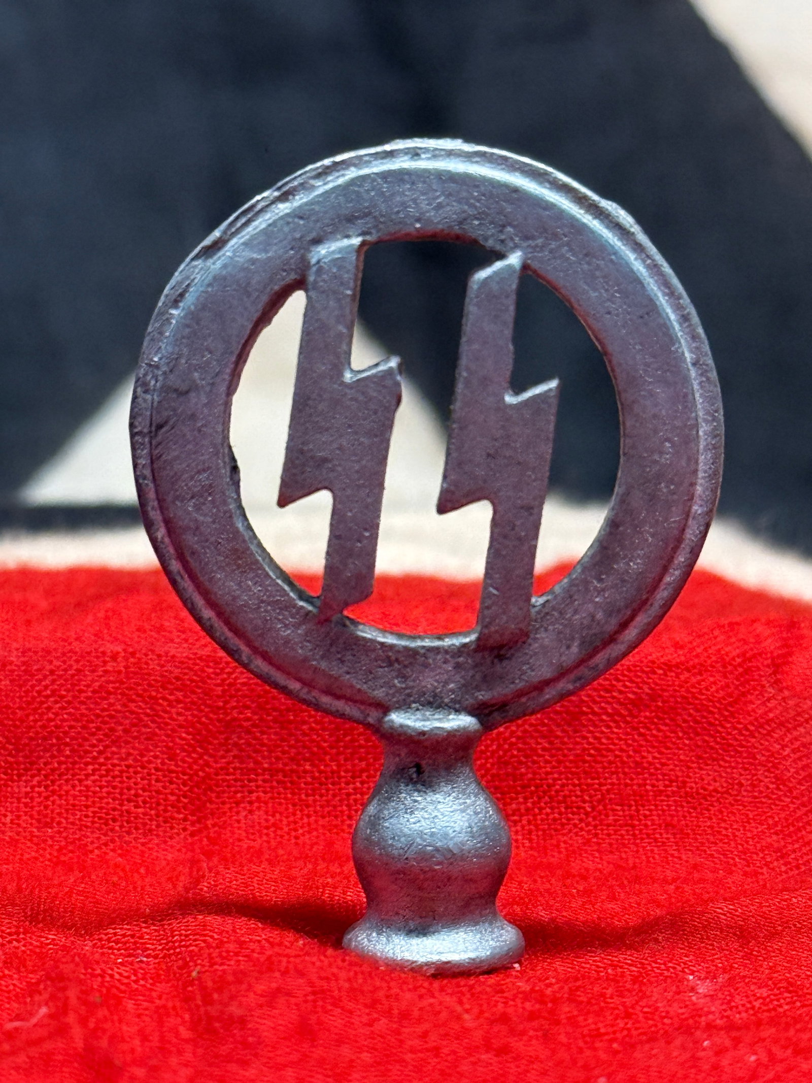 WWII German Waffen-SS Vehicle Pennant Pole Finial: This WWII German Waffen-SS Vehicle Pennant Pole Finial features the iconic SS runes enclosed within a circular border mounted atop a turned pedestal designed for attachment to a vehicle flagstaff or p