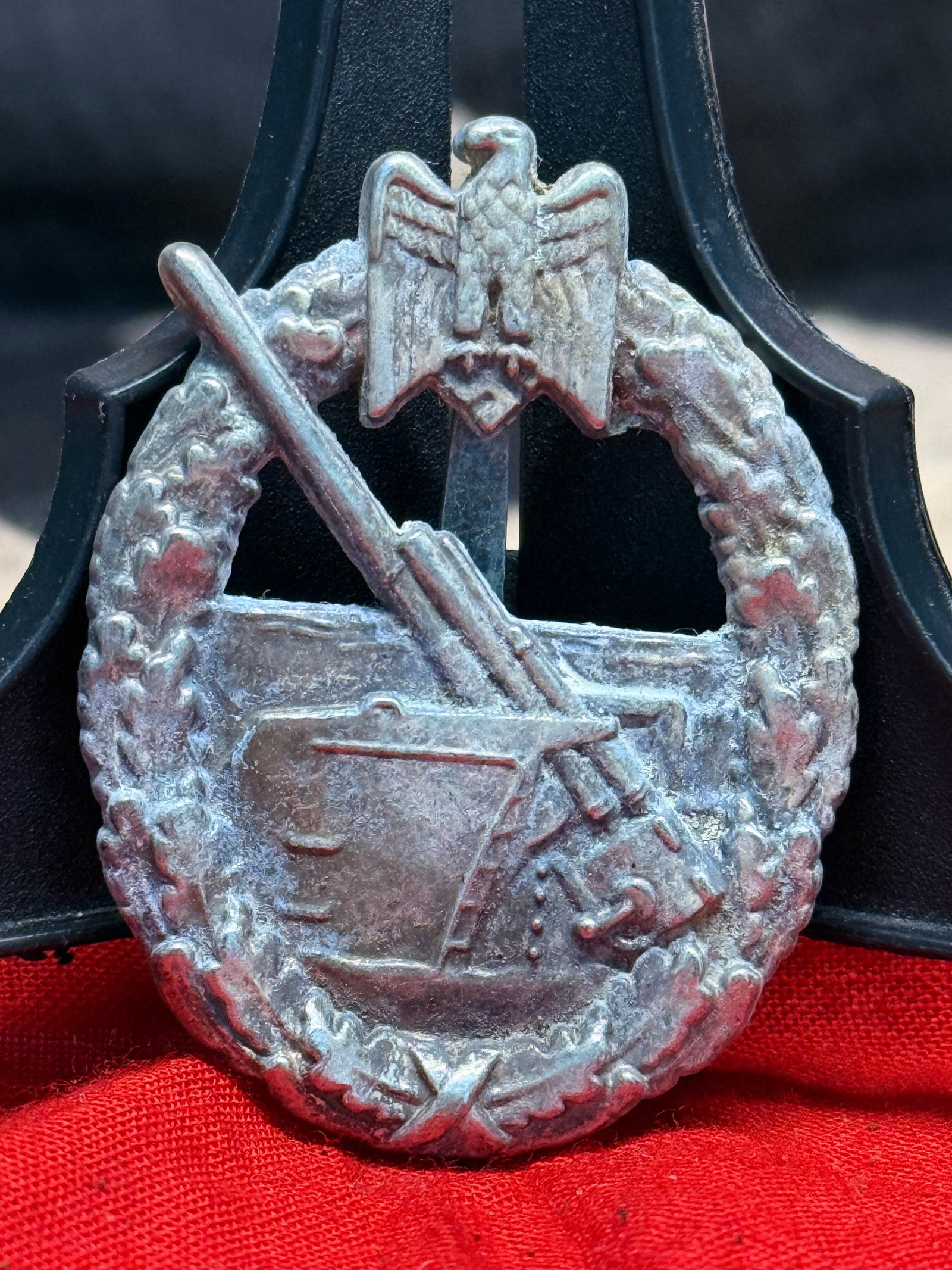 WWII German Kriegsmarine Destroyer War Badge By Schwerin Berlin: This badge depicts a German destroyer cutting through heavy seas beneath the national eagle and wreath, identifying it as the Kriegsmarine Destroyer War Badge (Zerstörer-Kriegsabzeichen). Instituted 