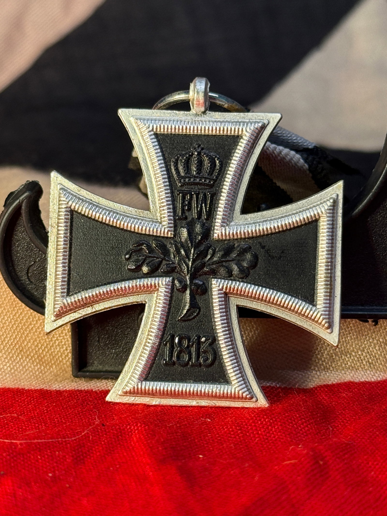 WWI Prussian Iron Cross 2nd Class 1870: This Prussian Iron Cross 2nd Class 1870 features a black iron center with a silver frame, displaying the royal crown above the letter "W" and the date 1870 on the obverse. The reverse bears the crowne