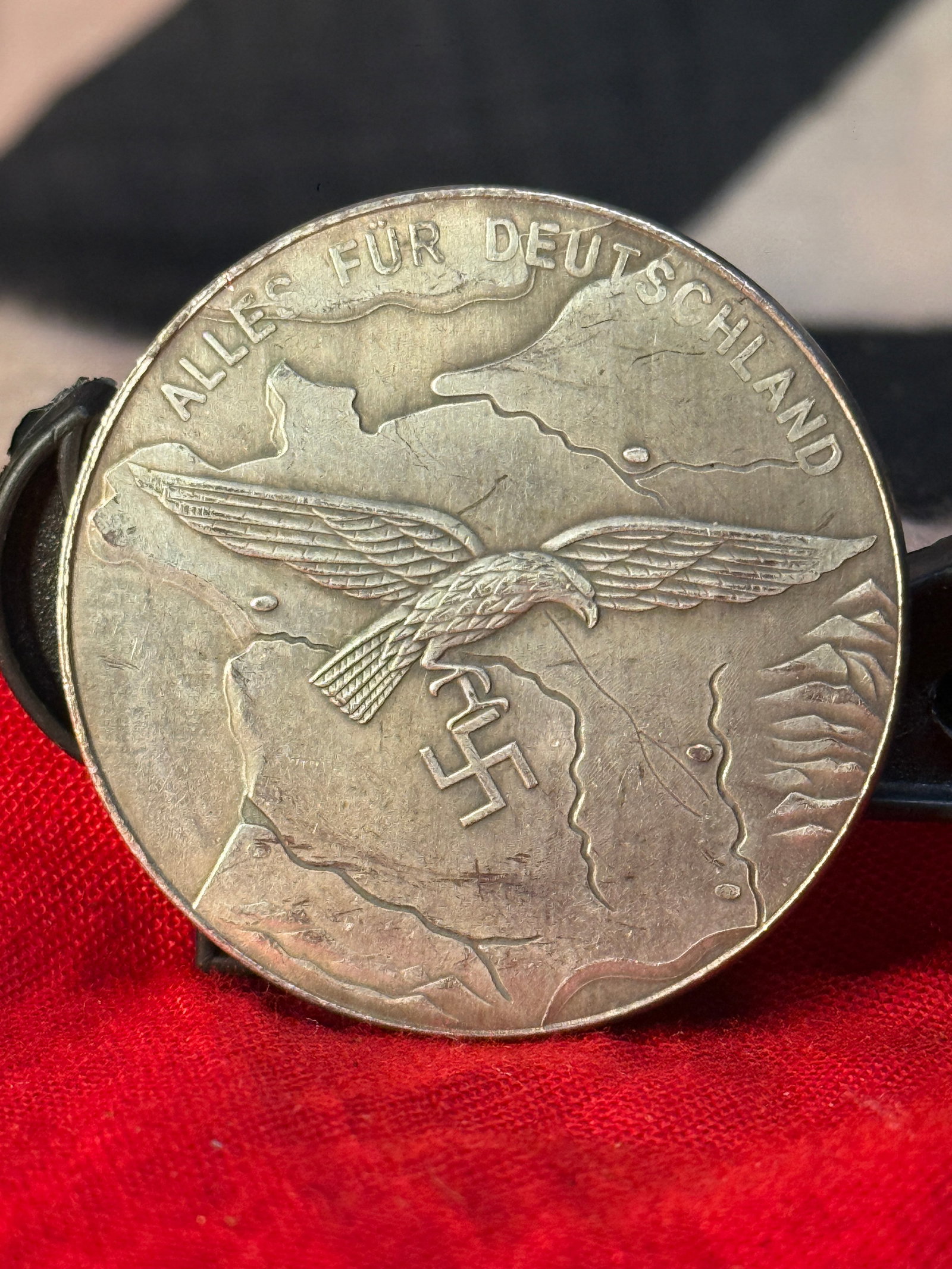 WWII German Luftwaffe Feldluftgaukommando Westfrankreich Presentation Medal: This WWII German Luftwaffe presentation medal bears the inscription "ALLES FÜR DEUTSCHLAND" above an eagle flying over a map on the obverse, while the reverse is inscribed "FÜR TREUE DIENSTLEISTUNGE