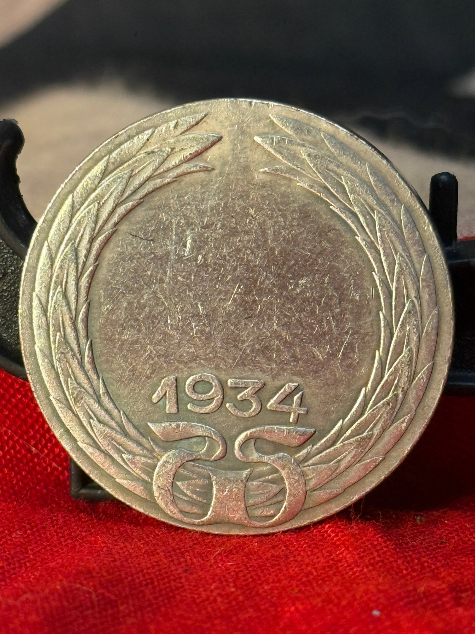 WWII Era Turkish Republic 100 Kuru? Silver Coin (1934): This silver 100 Kuru? coin was issued by the Republic of Turkey in 1934, during the presidency of Mustafa Kemal Atatürk. One side displays the denomination within a decorative laurel wreath and the d