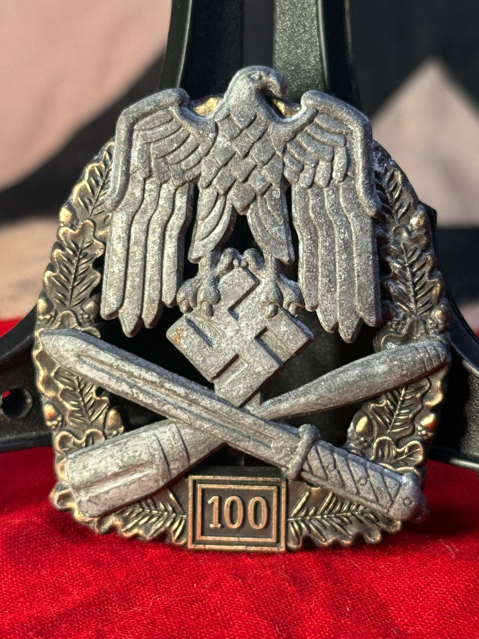 WWII German Army General Assault Badge with 100 Engagements By JFS: This high-grade General Assault Badge features the Wehrmacht eagle clutching a swastika above crossed bayonet and stick grenade enclosed within an oak leaf wreath, with the distinctive "100" engagemen