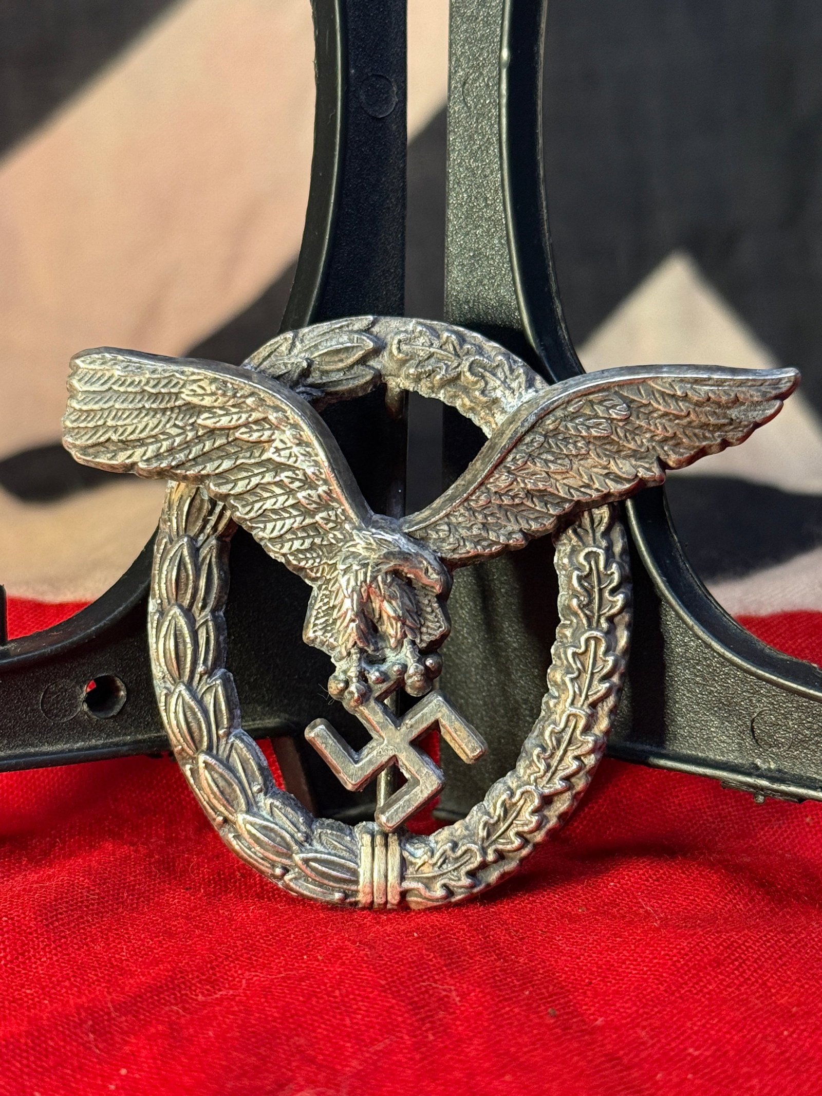 WWII German Luftwaffe Pilot's Badge: This Luftwaffe Pilot's Badge (Flugzeugführerabzeichen) features a finely detailed spread-wing eagle clutching a swastika superimposed over an oval wreath of laurel and oak leaves. Instituted in 1935,