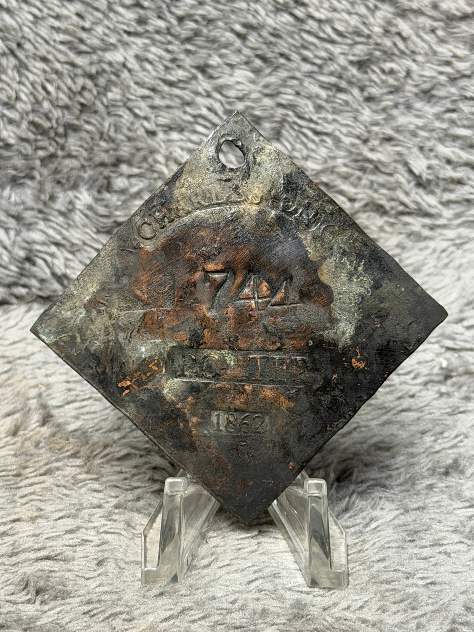 Dated 1862 Charleston Slave Tag No. 744 Porter Enslaved Hire Identification Badge: Diamond-shaped Charleston slave hire tag marked “CHARLESTON” across the upper portion, numbered “744” at center, with “PORTER” below and the date “1862” near the bottom