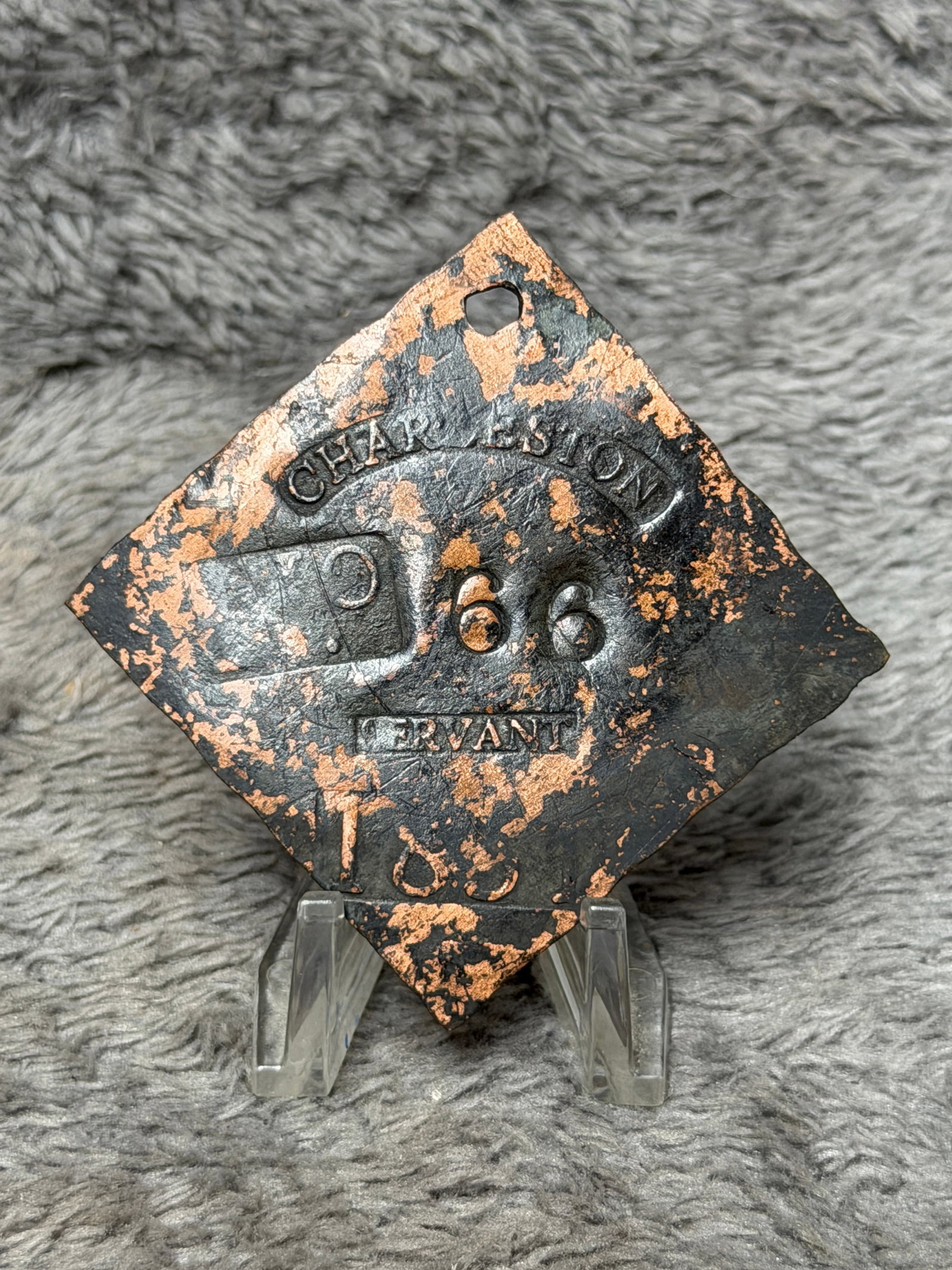 Dated 1863 Charleston Slave Tag No. 66 Servant Enslaved Hire Identification Badge: Diamond-shaped Charleston slave hire tag marked “CHARLESTON” in a curved banner across the upper portion, with the number “66” at center, “SERVANT” occupational designation bel