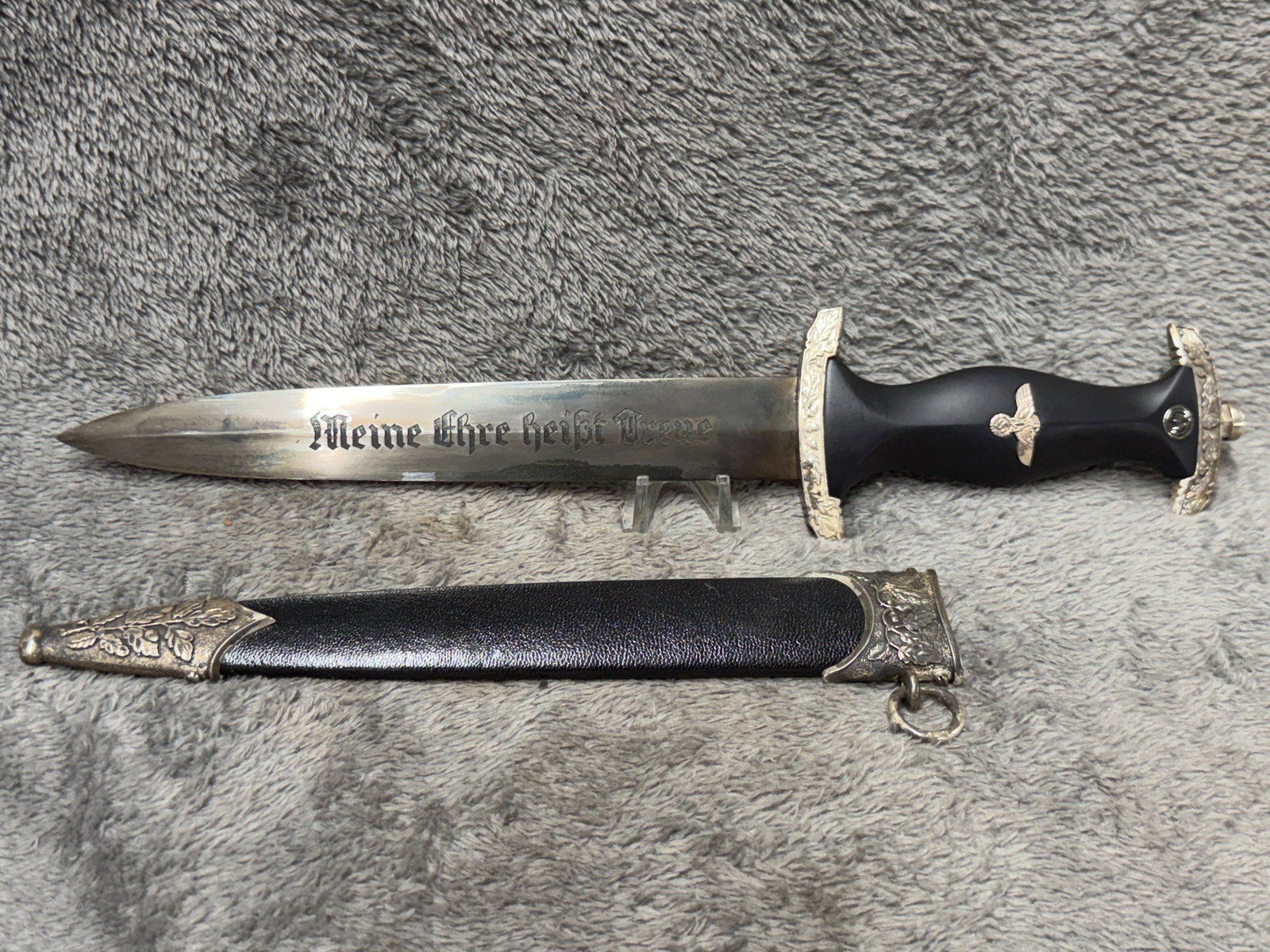 WWII German SS Honor Dagger “Meine Ehre heißt Treue?? Eichhorn Solingen with Scabbard: German-style dress dagger featuring a polished double-edged blade with the Gothic inscription “Meine Ehre heißt Treue” on one side and a script inscription with a circular “CARL EICKHORN SO