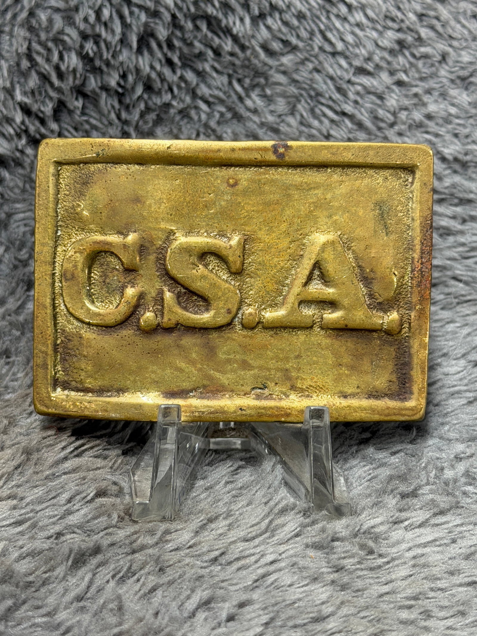 Civil War Confederate CSA Brass Rectangular Belt Plate: This substantial brass belt plate features the raised letters “C.S.A.” prominently displayed across the face, representing the Confederate States of America. The rectangular plate has a heavy 