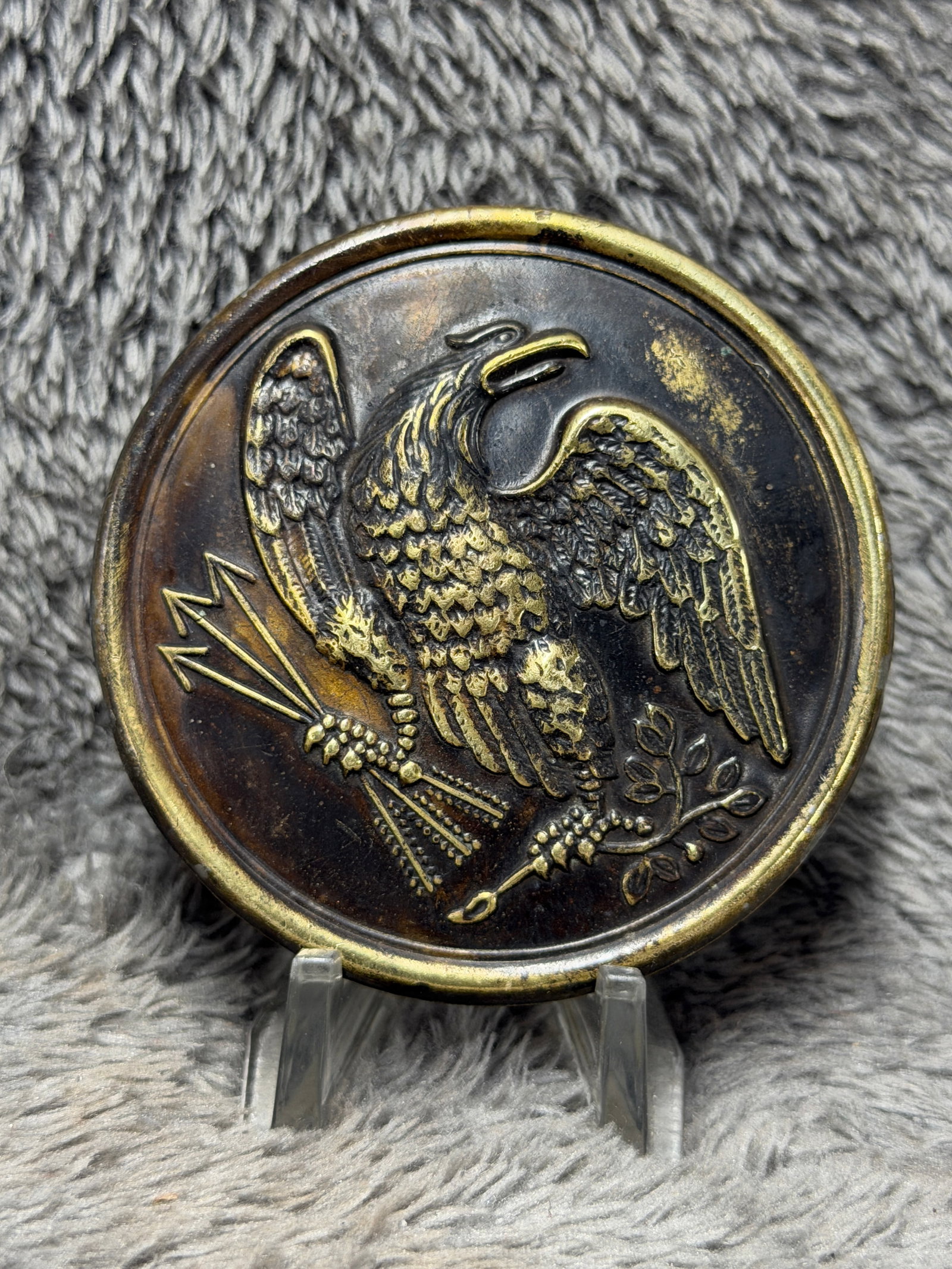 Civil War U.S. Army Eagle Breast Plate – Federal Union Equipment Plate: This striking Civil War-era U.S. Army breast plate features a boldly embossed American eagle with outstretched wings, clutching arrows in one talon and an olive branch in the other, surrounded by a ra