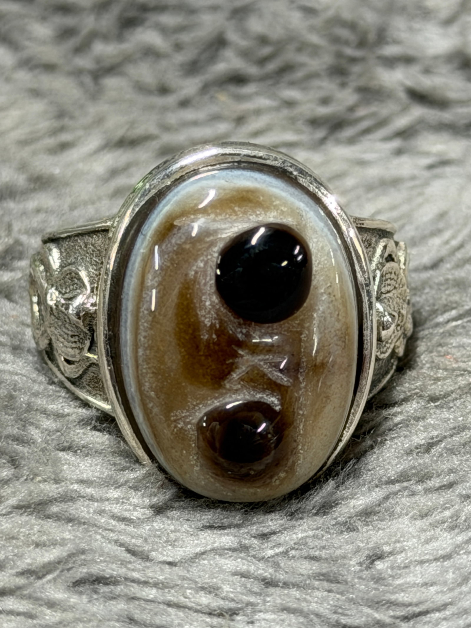 WWII German Waffen-SS Division Officer .800 Silver Agate Ring: A striking WWII German Waffen-SS division officer ring constructed in .800 silver and dominated by a large oval polished agate centerpiece. The stone displays dramatic natural banding in shades of cre