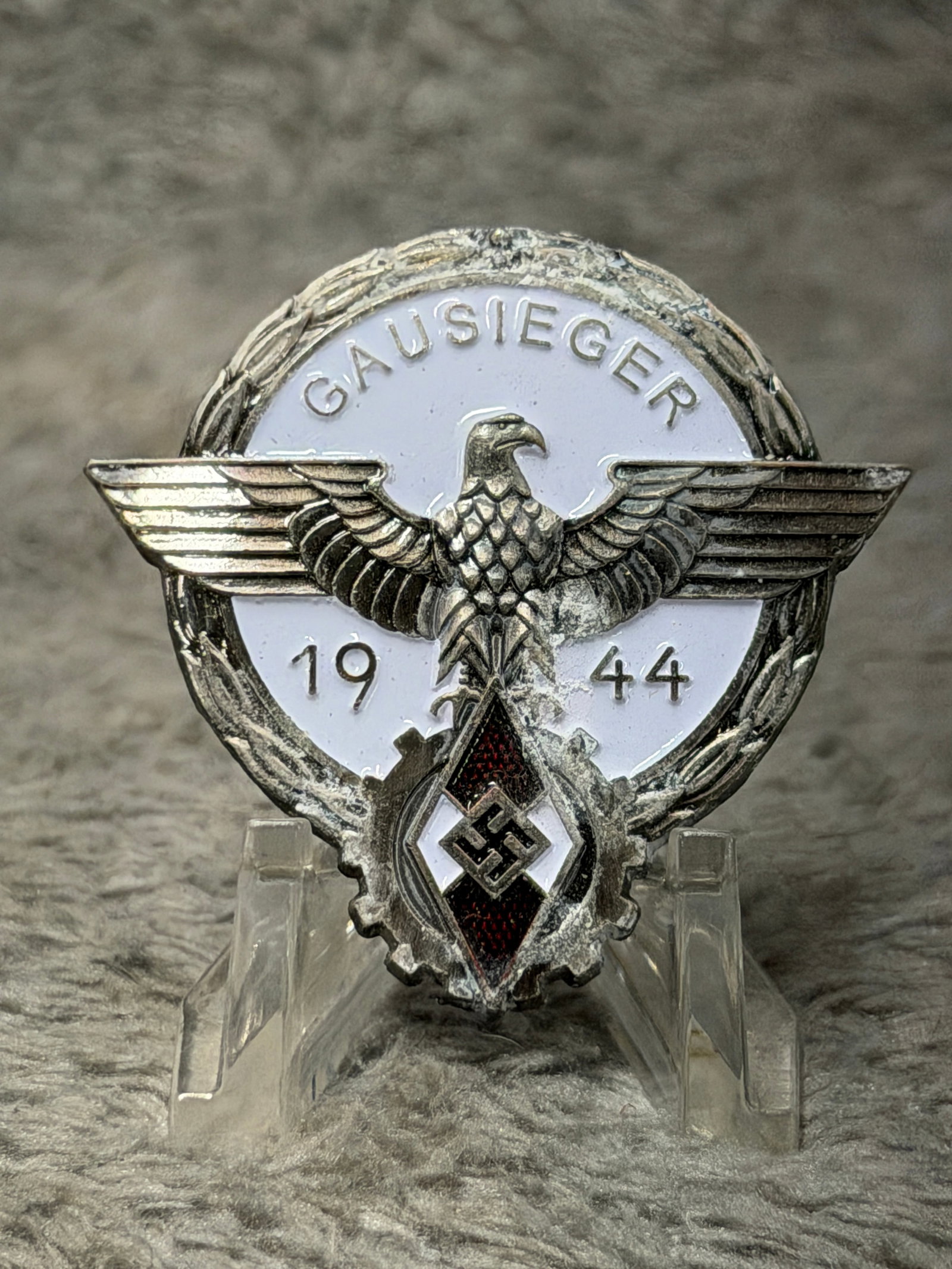 WWII German Hitler Youth 1944 “Gausieger?? Regional Vocational Competition Badge: Striking WWII German Hitler Youth “Gausieger” badge dated 1944, associated with the regional-level awards of the Reich vocational competition. The badge features a prominent spread-winged eagl