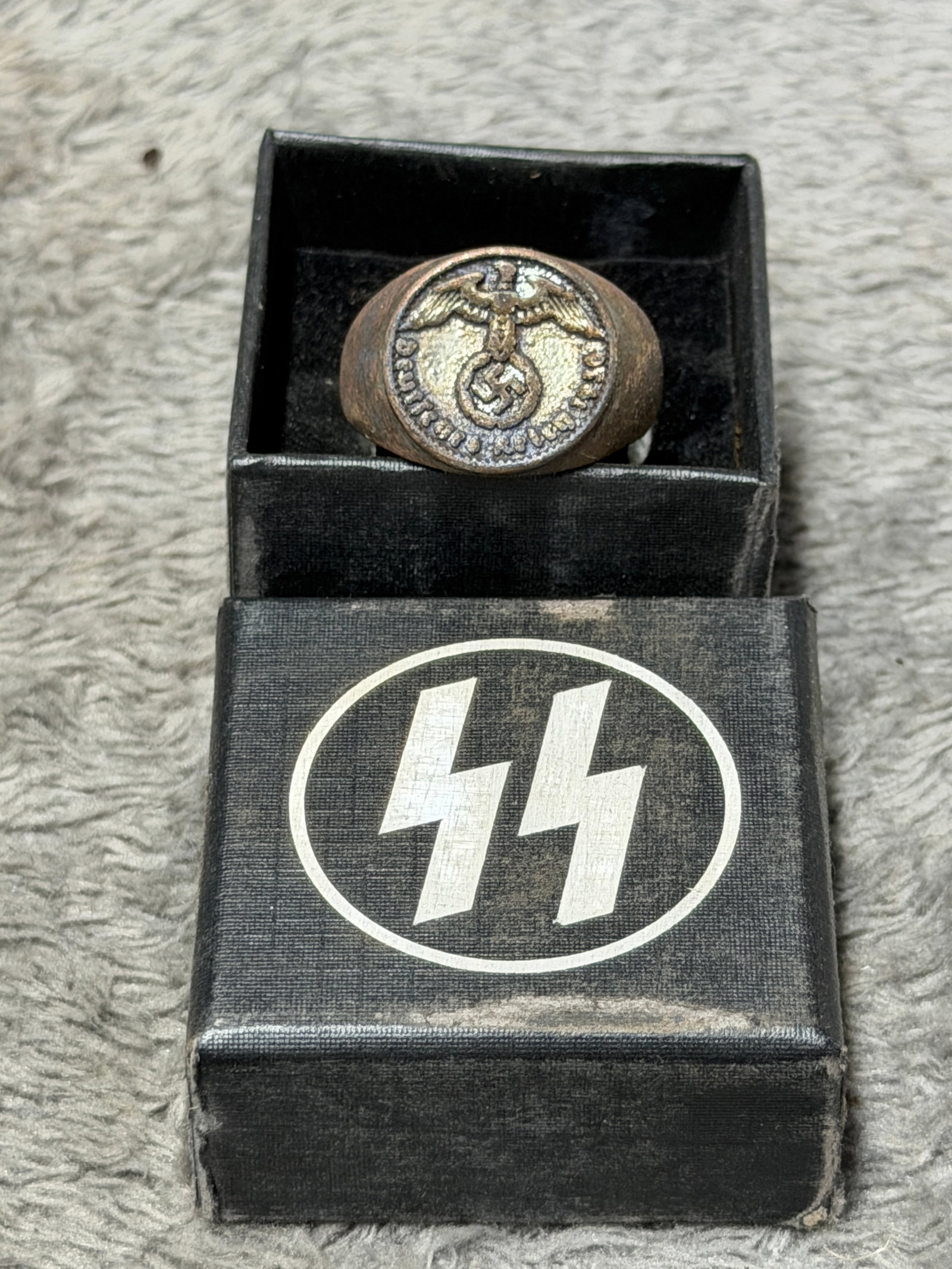 WWII German SS “Meine Ehre Heißt Treue?? Eagle & Swastika Signet Ring: Impressive WWII German SS-themed signet ring featuring a large circular face with a raised German eagle clutching a wreath and swastika, surrounded by the inscription “Meine Ehre heißt Treue,&rdquo