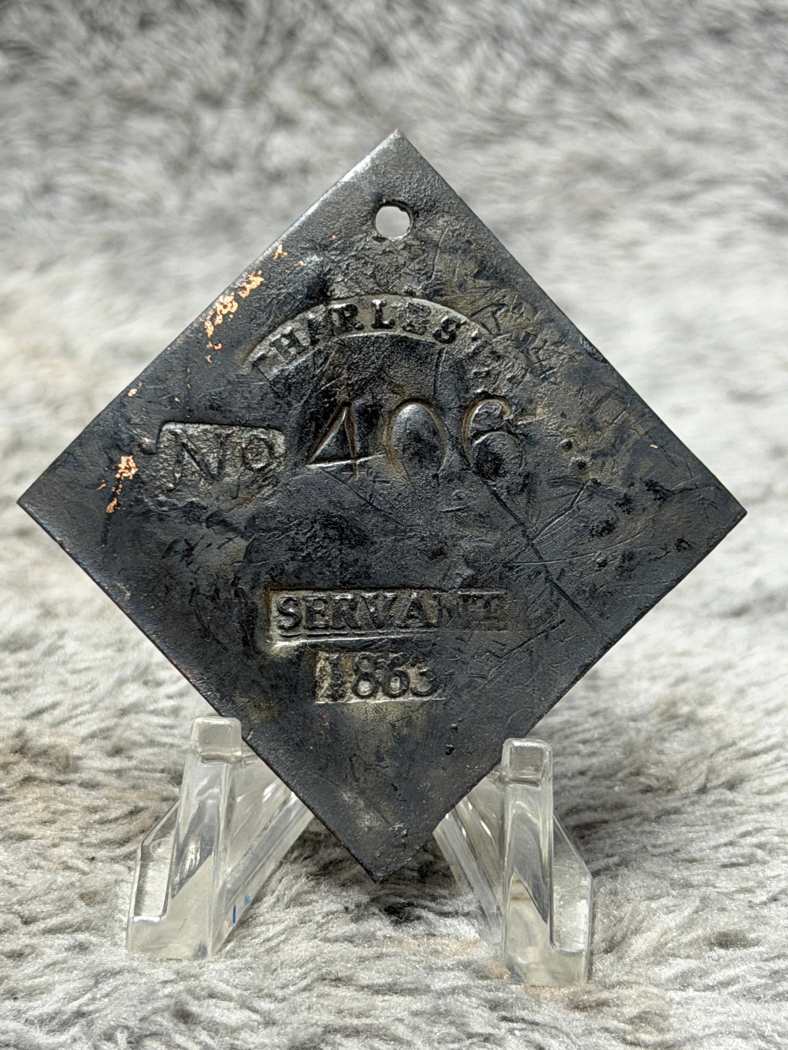 1833 Charleston South Carolina No. 406 Servant Slave Hire Identification Tag: Historically significant 1833 Charleston, South Carolina slave hire identification tag, constructed in the distinctive diamond-shaped form with a pierced suspension hole positioned near the upper poin