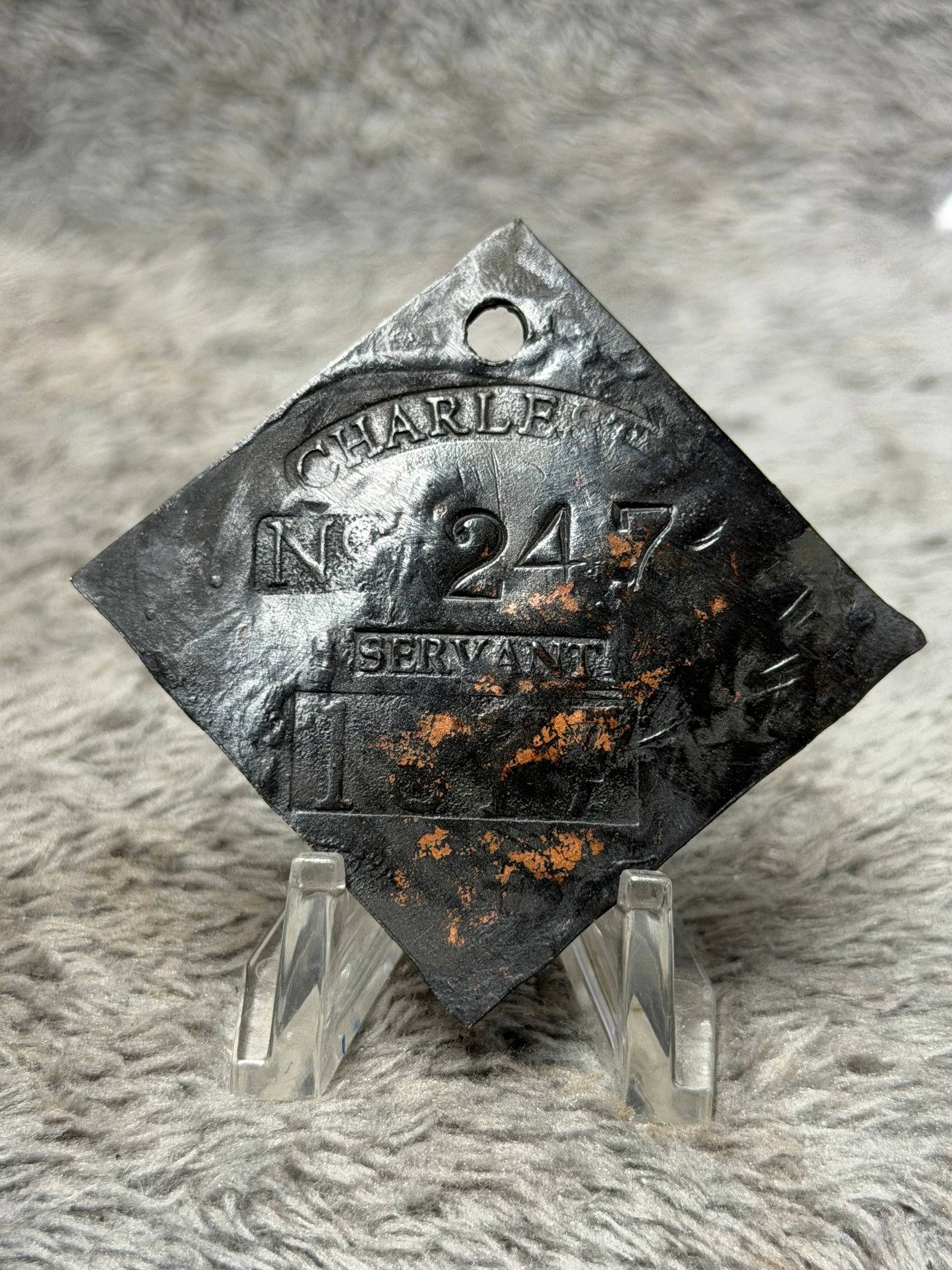 1833 Charleston South Carolina No. 247 Servant Slave Hire Identification Tag: Historically significant 1833 Charleston, South Carolina slave hire identification tag, formed in the recognizable diamond configuration with a pierced suspension hole at the upper point. The face bea