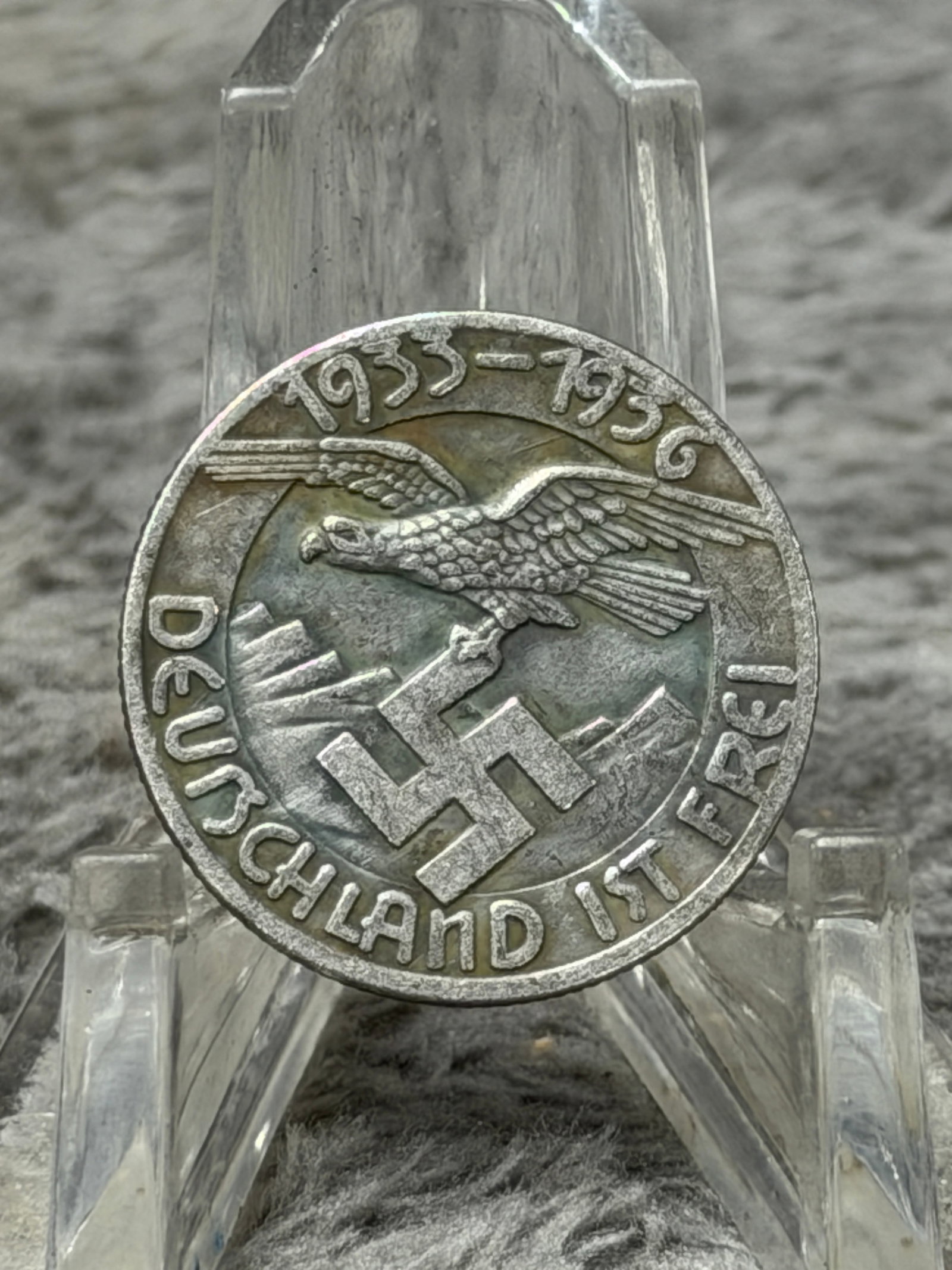 WWII German 1935–1936 Deutschland Ist Frei Austrian Anschluss Commemorative Medal: WWII-era German political commemorative medal dated 1935–1936, featuring a dramatic raised central composition of a German eagle flying above mountainous terrain and carrying a swastika. The perimet