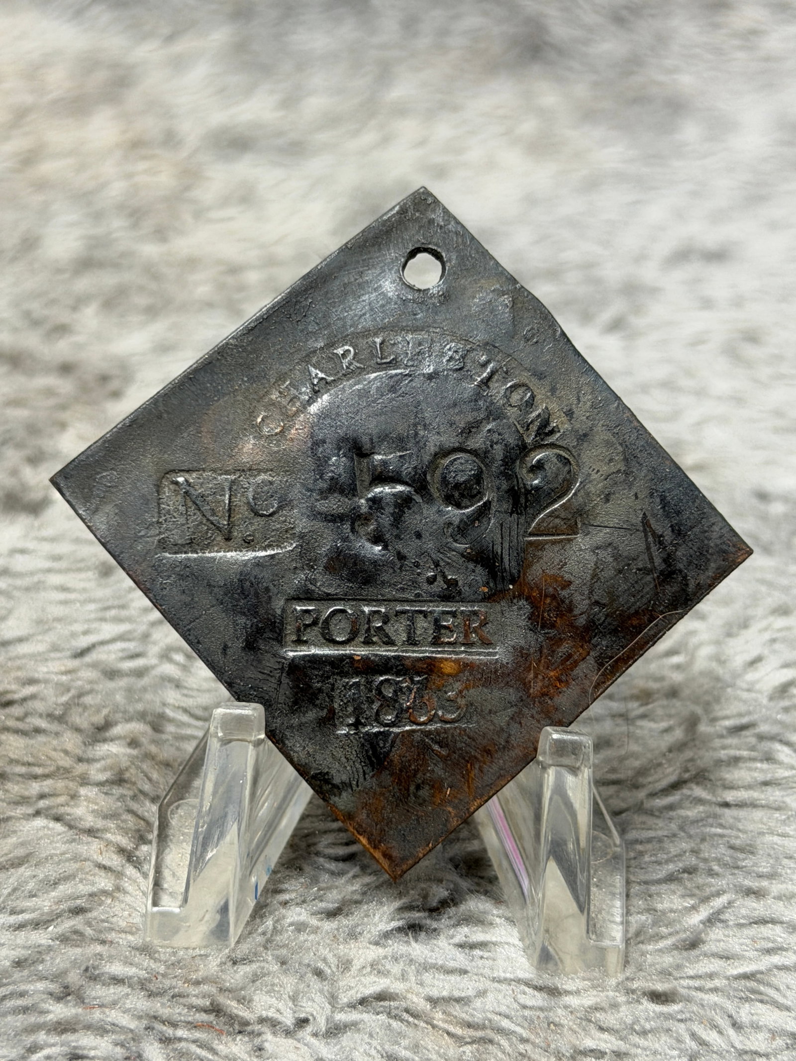 1859 Charleston South Carolina Slave Hire Tag – Porter No. 592: Historically significant 1859 Charleston, South Carolina slave hire tag bearing the occupational designation “PORTER” and identification number “592.” The tag is fashioned in a distinc