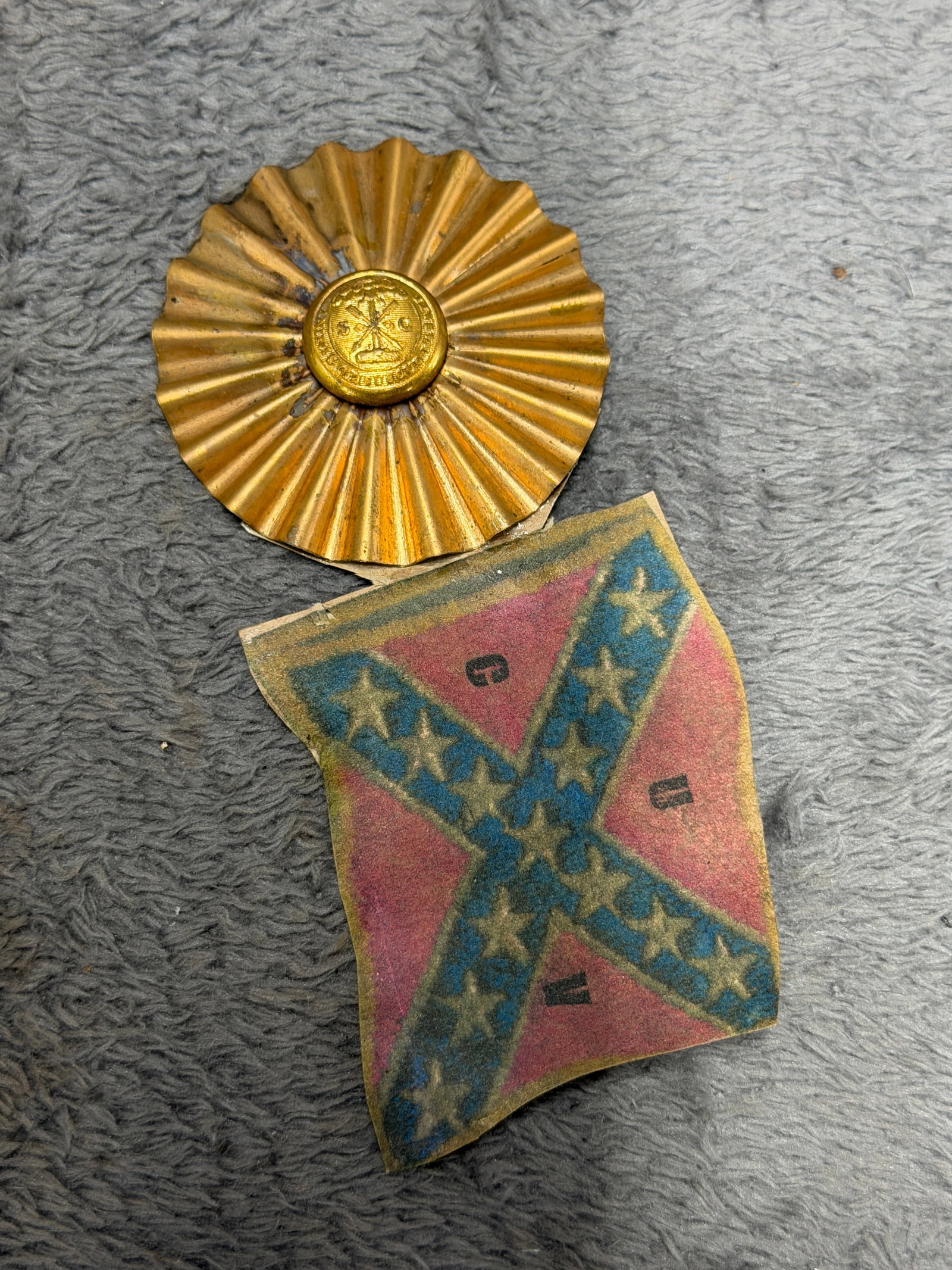 Civil War Confederate CSA UCV Veteran Reunion Badge with Confederate Battle Flag & South Carolina: Striking Confederate veteran reunion badge featuring a large gold-tone pleated rosette surmounted by a central button displaying the South Carolina palmetto tree and crossed symbolic elements, with a 