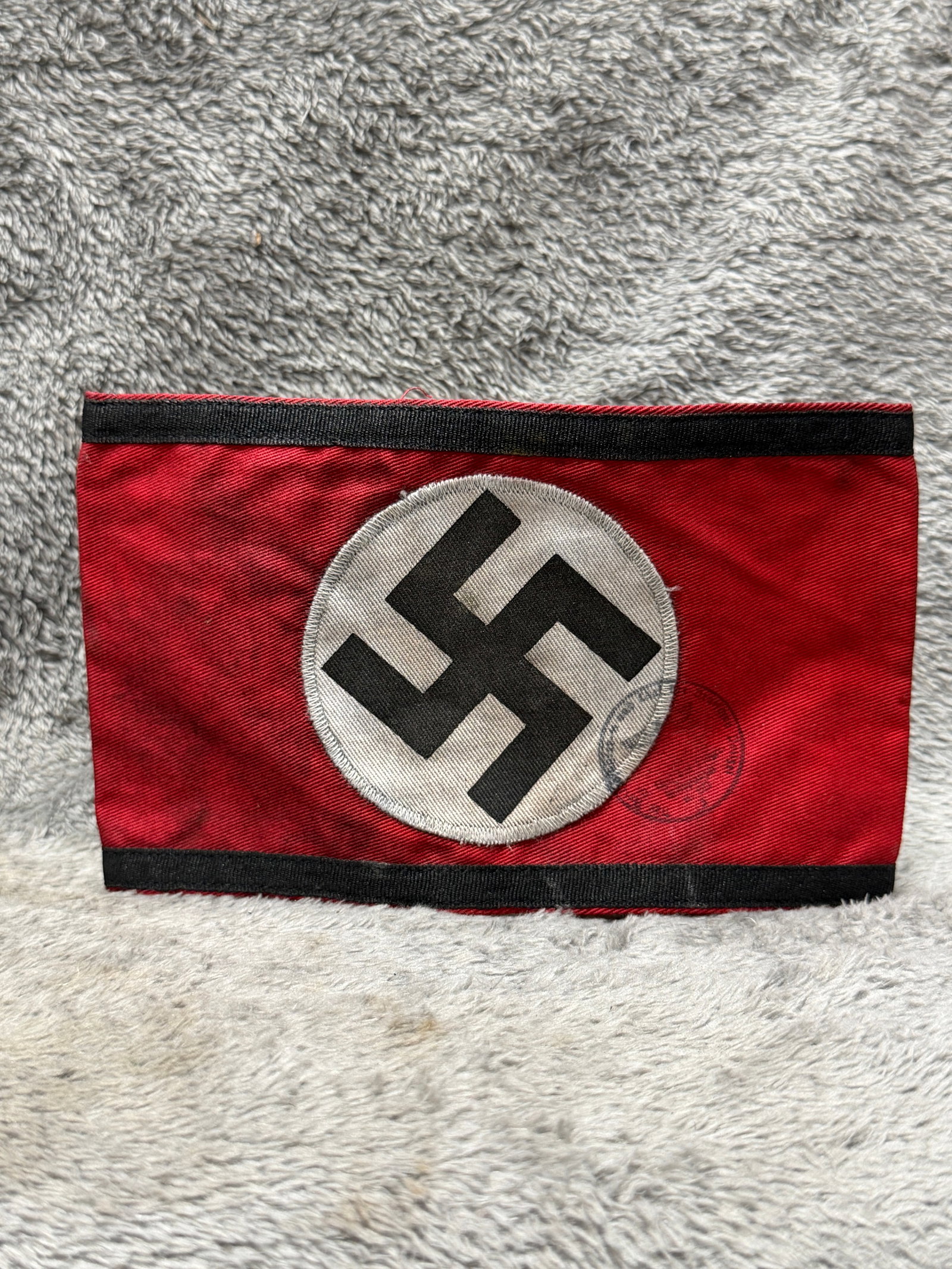 WWII German NSDAP Political Leader Swastika Armband with RZM Ink Stamps: WWII German NSDAP political armband constructed from red fabric with contrasting black woven borders along the upper and lower edges and a large white circular field bearing a black swastika at center