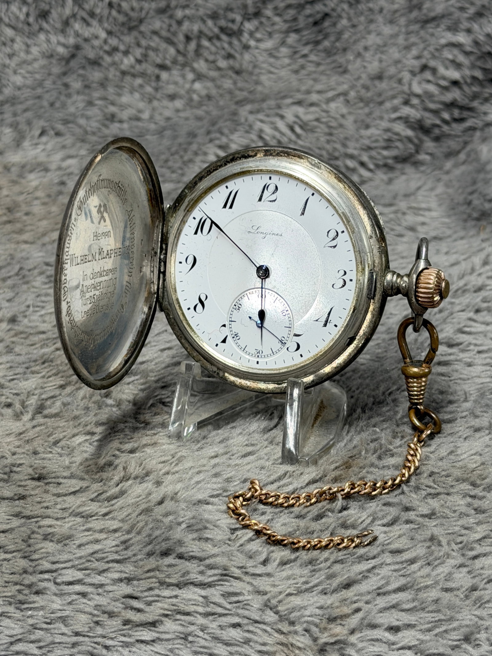 WW2 Longines German 25-Year Faithful Service Presentation Pocket Watch – Wilhelm Klapheck: Striking Longines open-face pocket watch presented as a German long-service recognition piece to Wilhelm Klapheck. The watch features a white dial signed “Longines,” distinctive black Arabic n