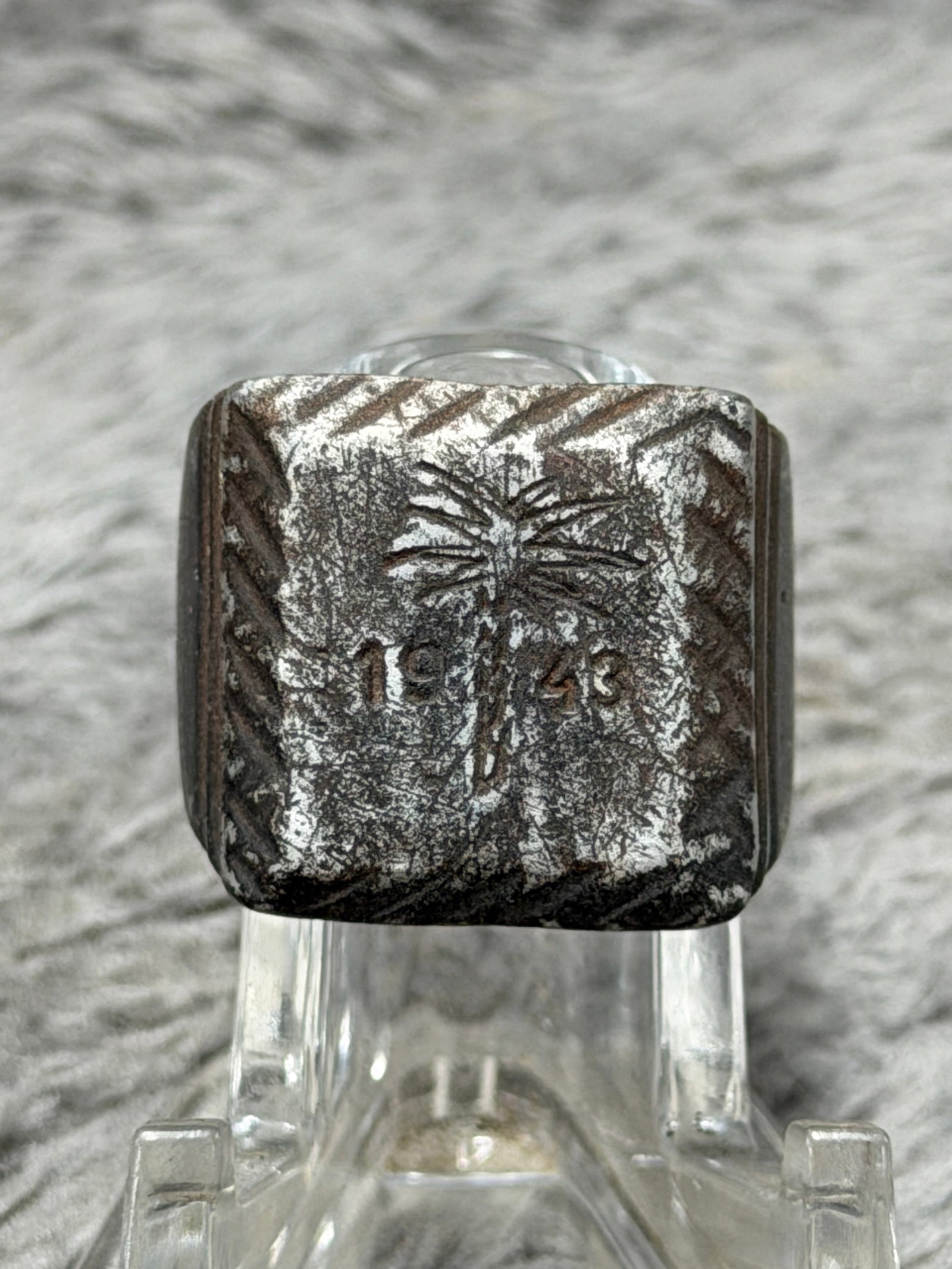 WWII German 1943 Palm Tree Afrika Korps Campaign Ring: WWII German military-themed finger ring featuring a large square face decorated with a palm tree motif above the date “1943,” imagery closely associated with German service and campaigning in 