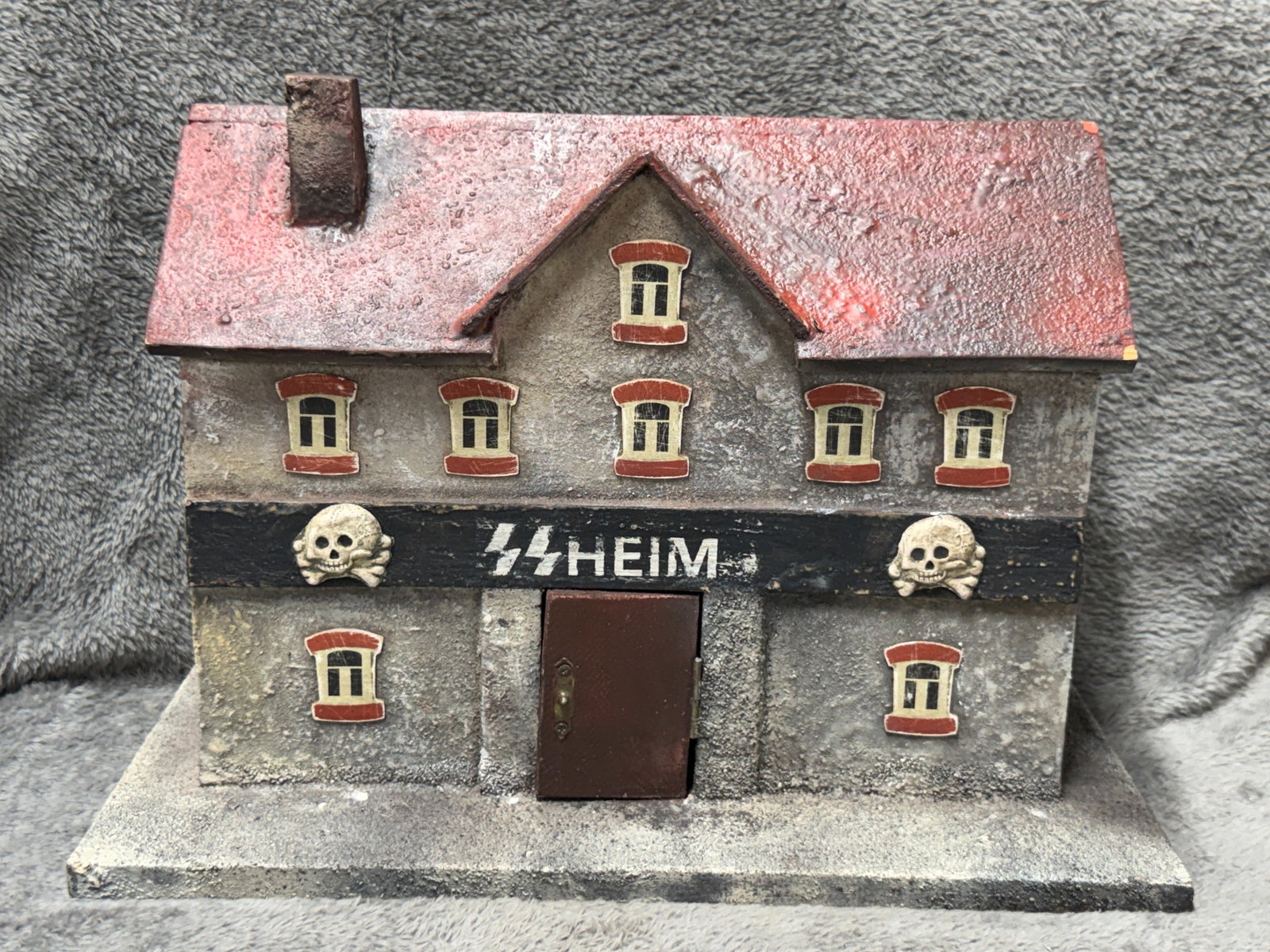 WWII German Waffen-SS “Heim?? Barracks Building Folk Art Display with Totenkopf Emblems: Unusual WWII German-themed miniature barracks or headquarters building constructed in a substantial architectural form with a pitched red roof, projecting central gable, chimney, raised base, multiple