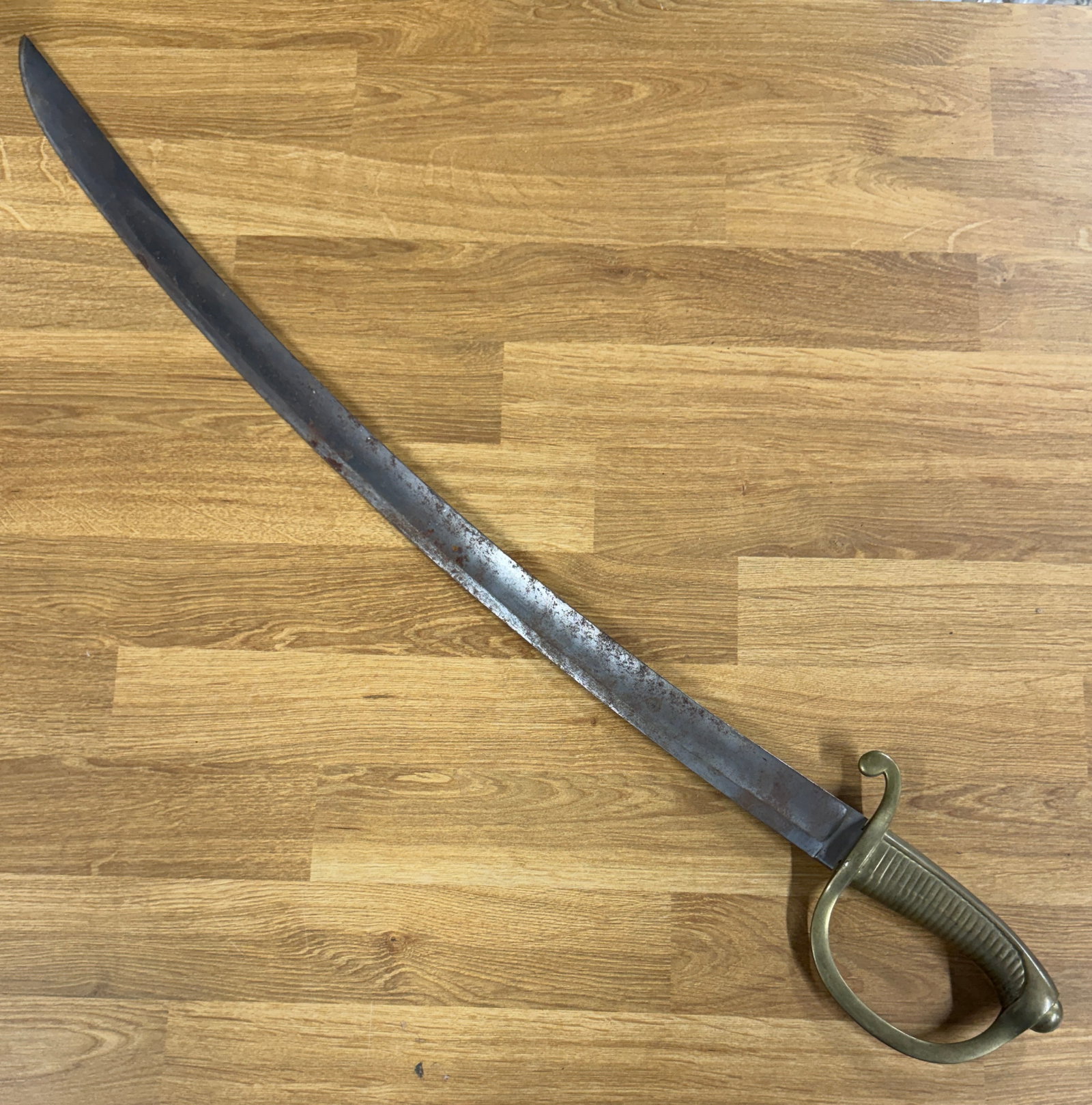 Civil War Confederate CSA Short Sword with Curved Blade & Brass D-Guard: A striking Civil War-era Confederate CSA short sword featuring a strongly curved single-edged steel blade paired with a substantial brass hilt and protective D-shaped knuckle guard. The blade exhibits
