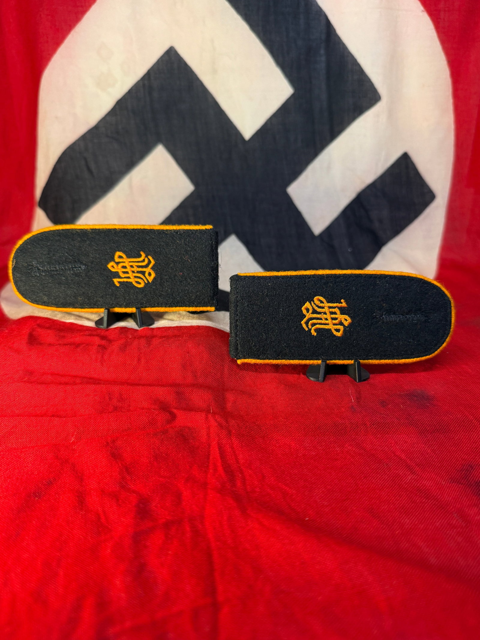 WWII German Luftwaffe Signals Nachrichten Pair of Enlisted Shoulder Boards: A matched pair of WWII German Luftwaffe enlisted shoulder boards constructed in dark cloth with distinctive golden-yellow branch piping around the rounded edges and embroidered yellow unit cyphers to 