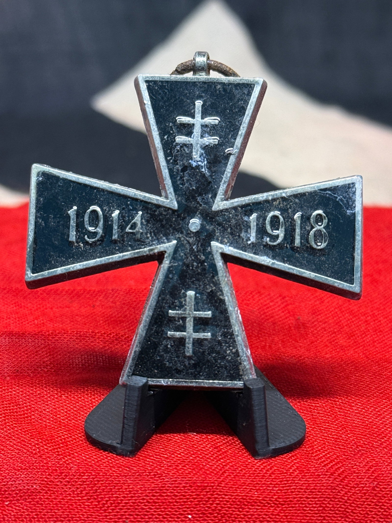 WWI Slovak Cross for the Great War 1914–1918 Medal: A distinctive Slovak commemorative cross honoring service connected with the First World War, formed as a broad black-finished cross with contrasting raised silver-colored borders and devices. The hor
