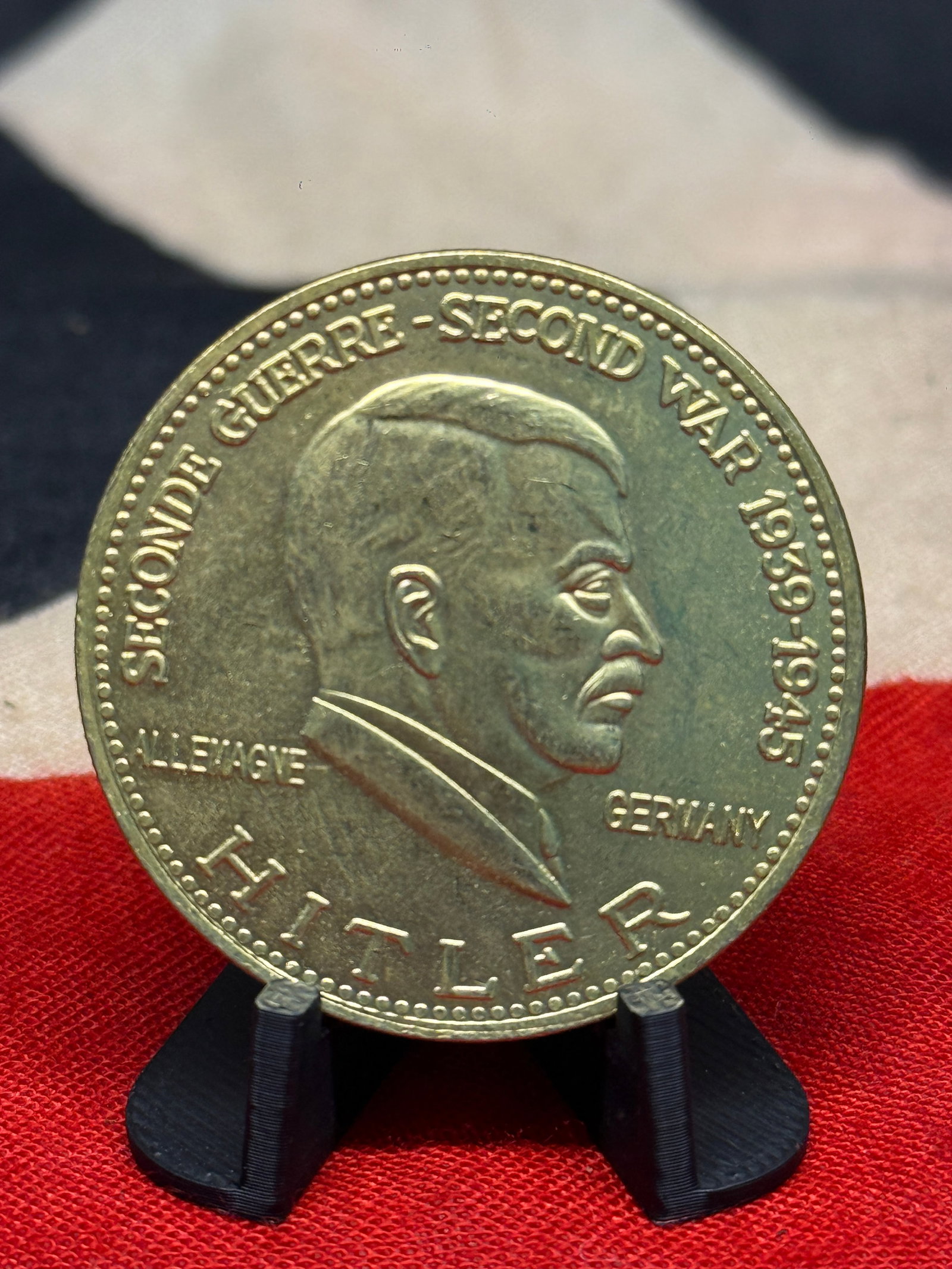 WWII German Adolf Hitler “Second World War 1939–1945?? International Numismatics Establishment: A substantial commemorative medal featuring a right-facing portrait of Adolf Hitler surrounded by the inscription “SECONDE GUERRE – SECOND WAR 1939 1945,” together with “ALLEMAGNE / GERMAN