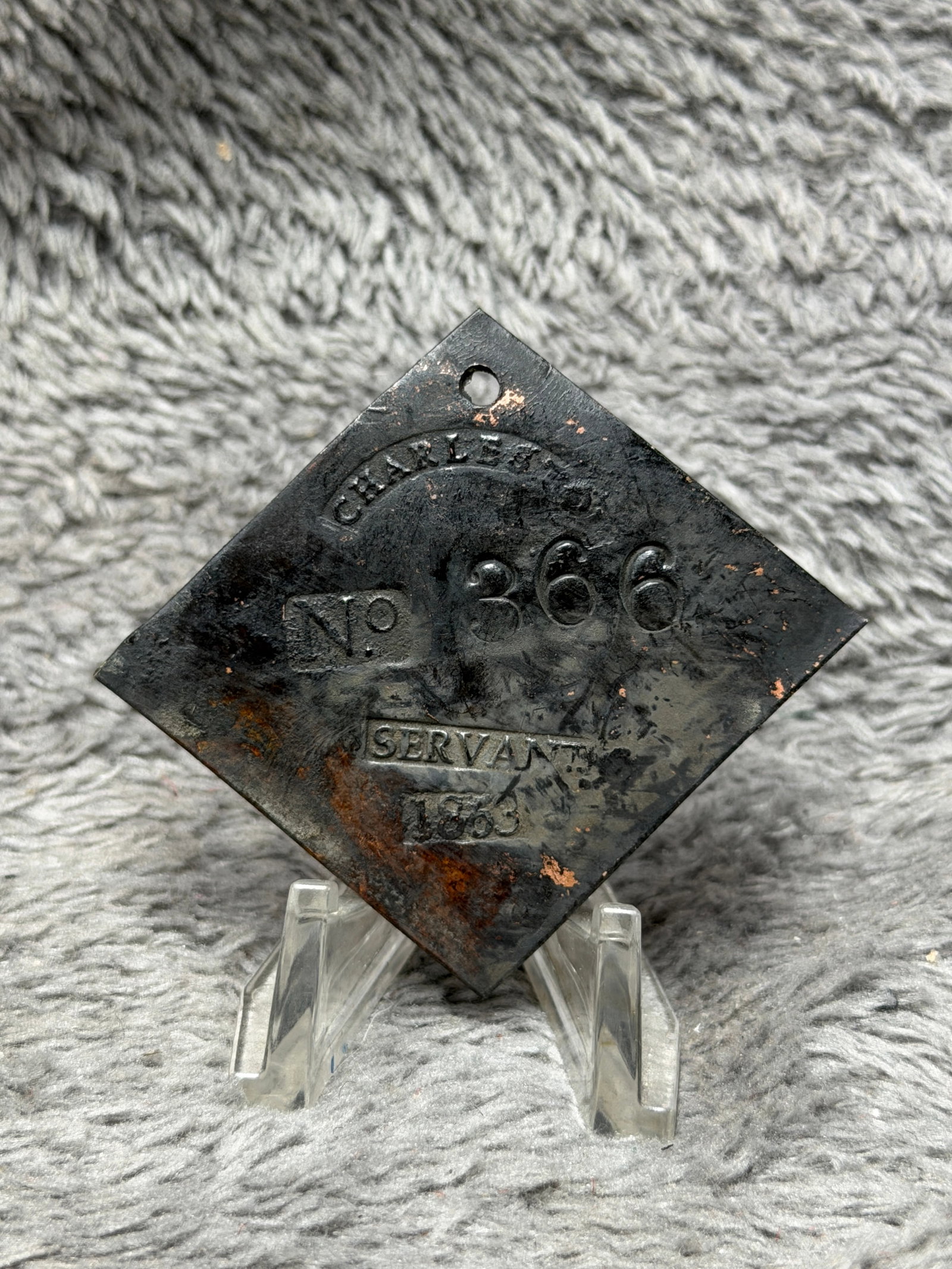 1855 Charleston No. 366 Servant Slave Hire Identification Tag: Dated 1855 Charleston slave hire identification tag featuring a distinctive diamond-shaped metal form with a pierced suspension hole positioned near the upper point. The face is prominently stamped wi