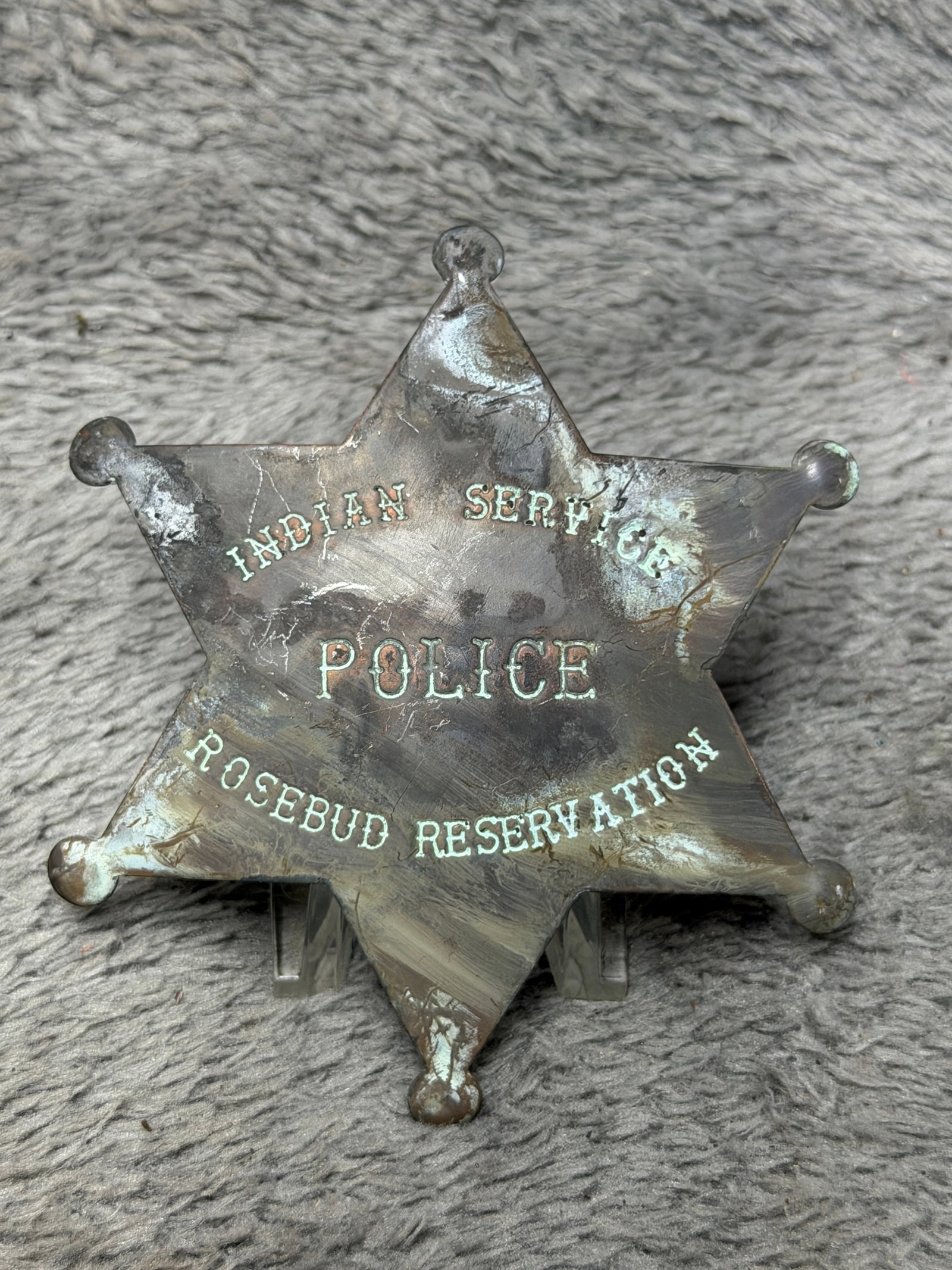 1800's Indian Service Police Rosebud Reservation Six-Point Star Badge: Striking six-pointed law enforcement badge marked “INDIAN SERVICE” across the upper field, “POLICE” prominently at center, and “ROSEBUD RESERVATION” along the lower portion. Th