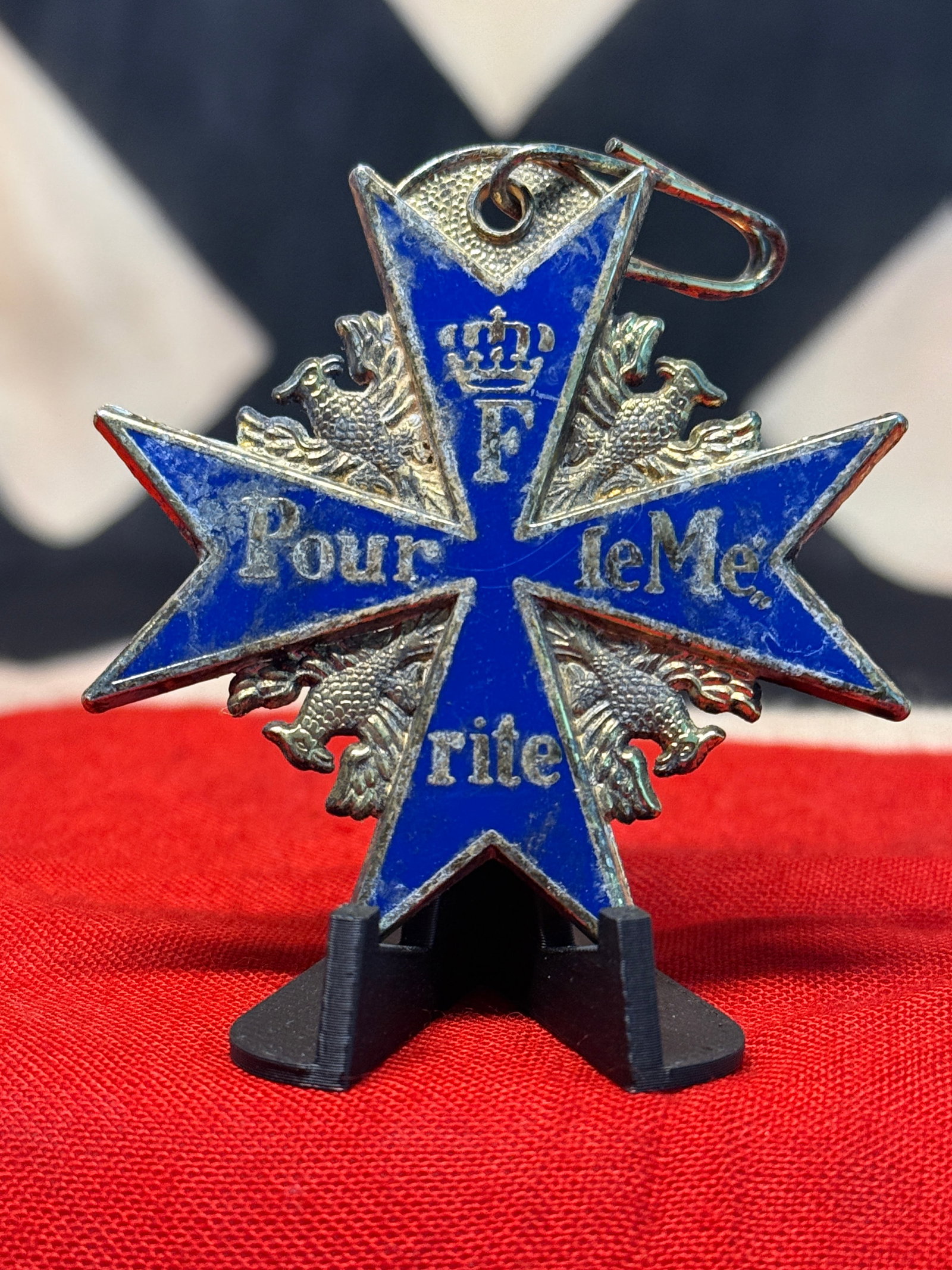 Imperial German Prussian “Pour le Mérite?? Blue Max Cross Pendant with Crowned F Monogram: A visually impressive blue-enameled cross pendant inspired by the celebrated Prussian Pour le Mérite, popularly known as the “Blue Max.” The cross displays deep cobalt-blue enamel bordered in