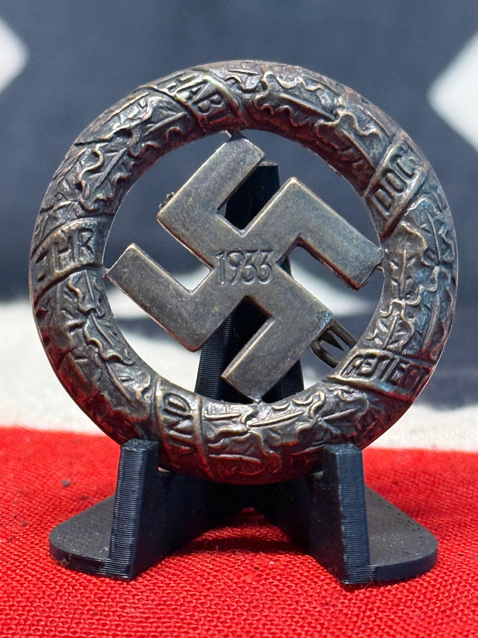 1933 German Third Reich Swastika & Oak Wreath Commemorative Political Badge: A large openwork political commemorative badge centered upon a bold swastika bearing the date “1933,” the year of the National Socialist seizure and consolidation of political power in Germany