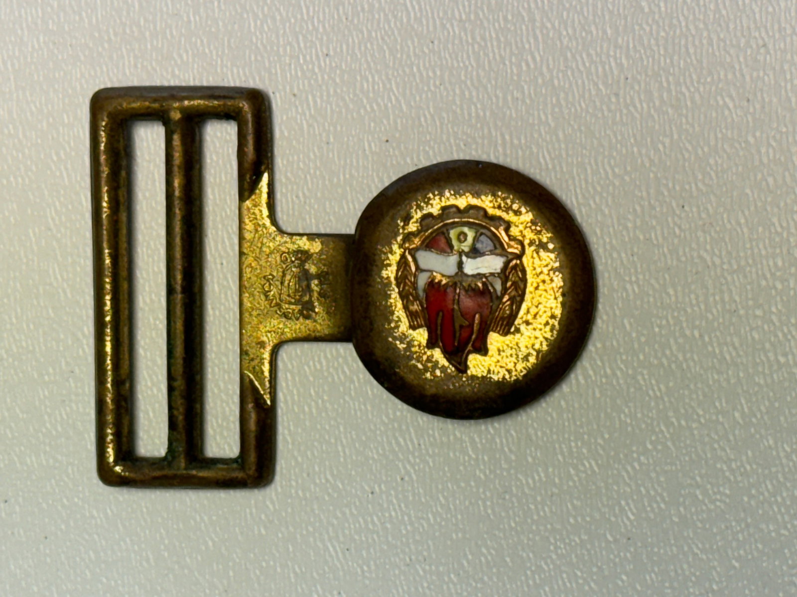 WWII German Kriegsmarine Naval Officer Dress Belt Buckle – Enameled Eagle Emblem: WWII German Kriegsmarine naval dress belt buckle featuring a gilt-finished metal construction with a rectangular double-slot belt fitting and prominent circular medallion. The face displays a finely d