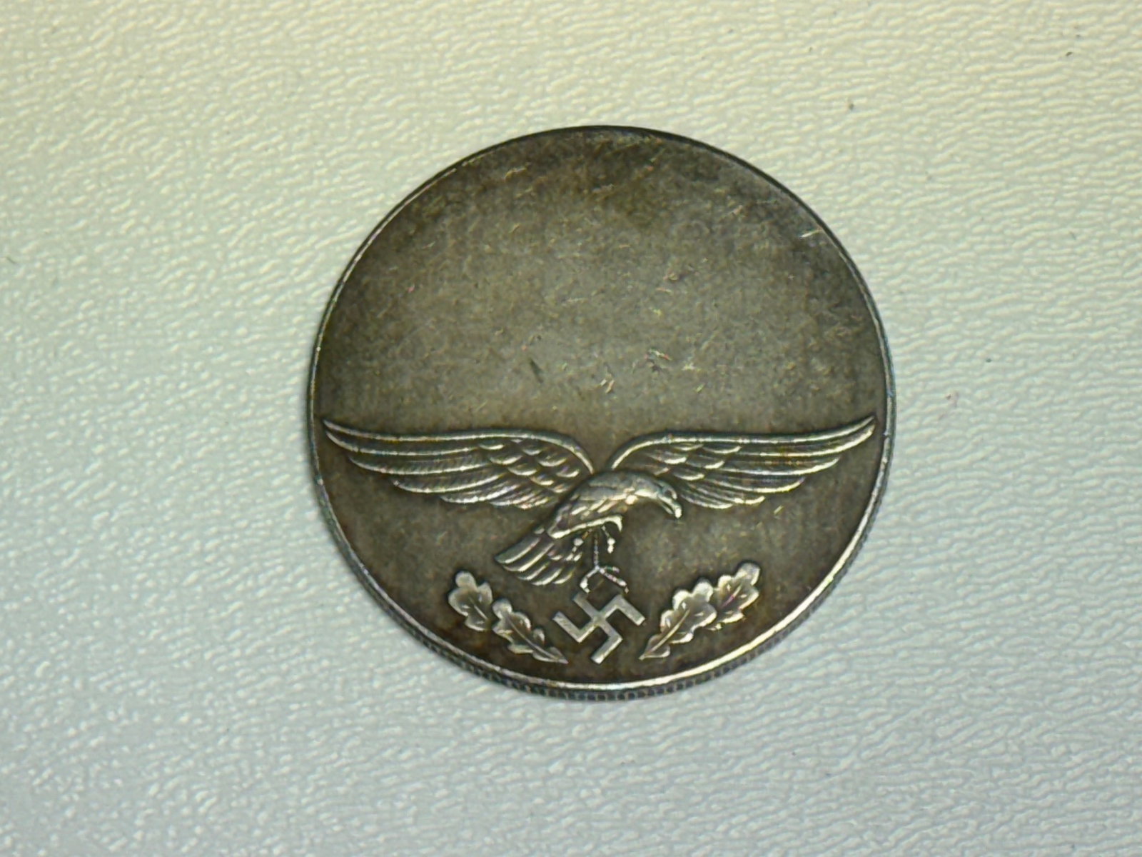 WWII German Luftwaffe Hermann Göring Commemorative Medallion – Eagle & Portrait: WWII German commemorative medallion featuring a detailed portrait of Hermann Göring surrounded by the German inscription “HERMANN GÖRING • REICHSMARSCHALL DES GROSSDEUTSCHEN REICHES.” T
