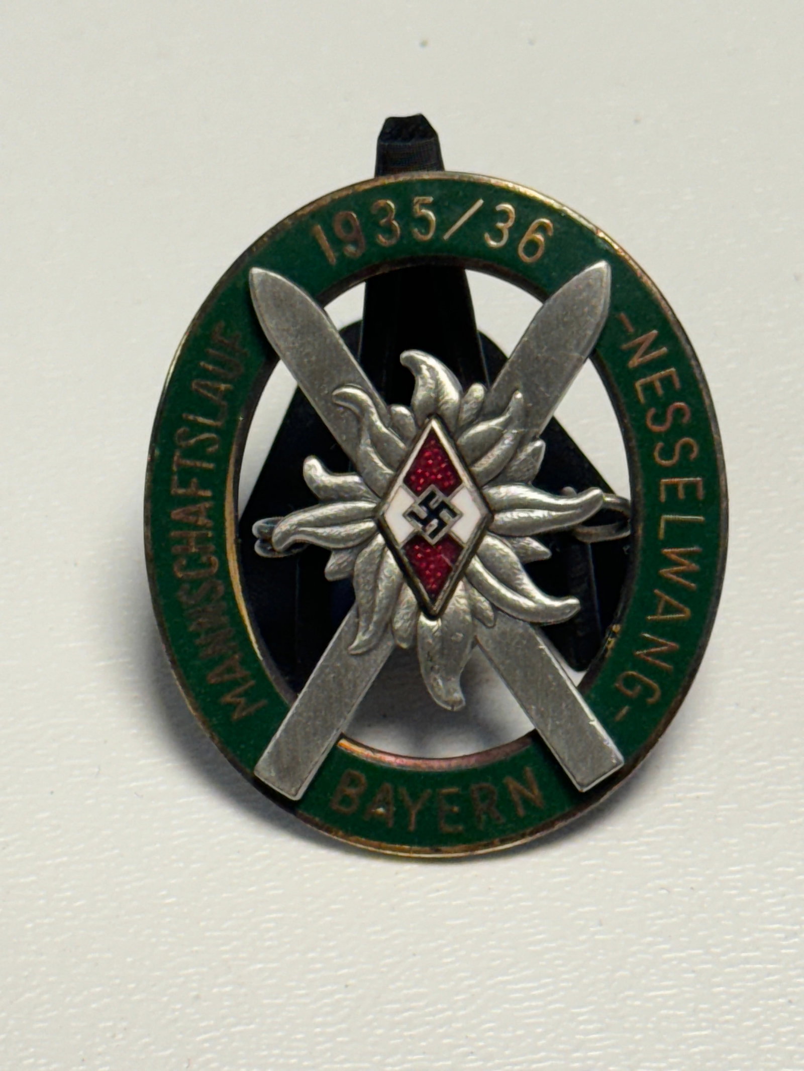 WWII German Hitler Youth HJ 1935/36 Bavarian Ski Championship Badge – Messelwang: WWII-era German Hitler Youth winter sports competition badge dated 1935/36 and inscribed “Mannschaftslauf – Messelwang – Bayern,” identifying a team skiing event held at Messelwang in Bava