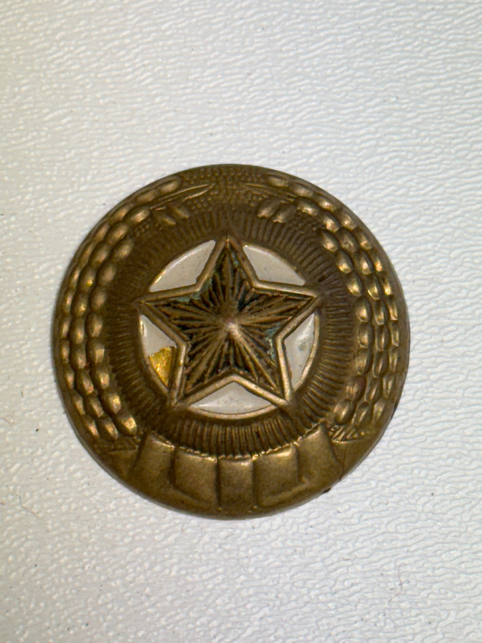 Soviet USSR Military Officer Star & Wheat Wreath Uniform Button: Soviet military uniform button featuring a prominent five-pointed star at the center surrounded by a circular sunburst field and an elaborate wheat or grain wreath motif, a design strongly associated 
