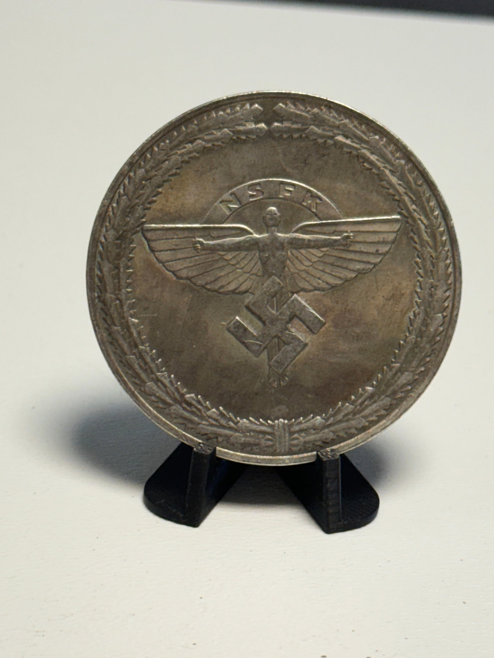 WWII German NSFK 1943 Hitler Youth Reich Competition Flying Achievement Winner Plaque: WWII German National Socialist Flyers Corps (NSFK) award plaque dated 1943, produced for flying achievement in the 2nd Reich Competition of the Hitler Youth. The obverse displays a large winged NSFK f