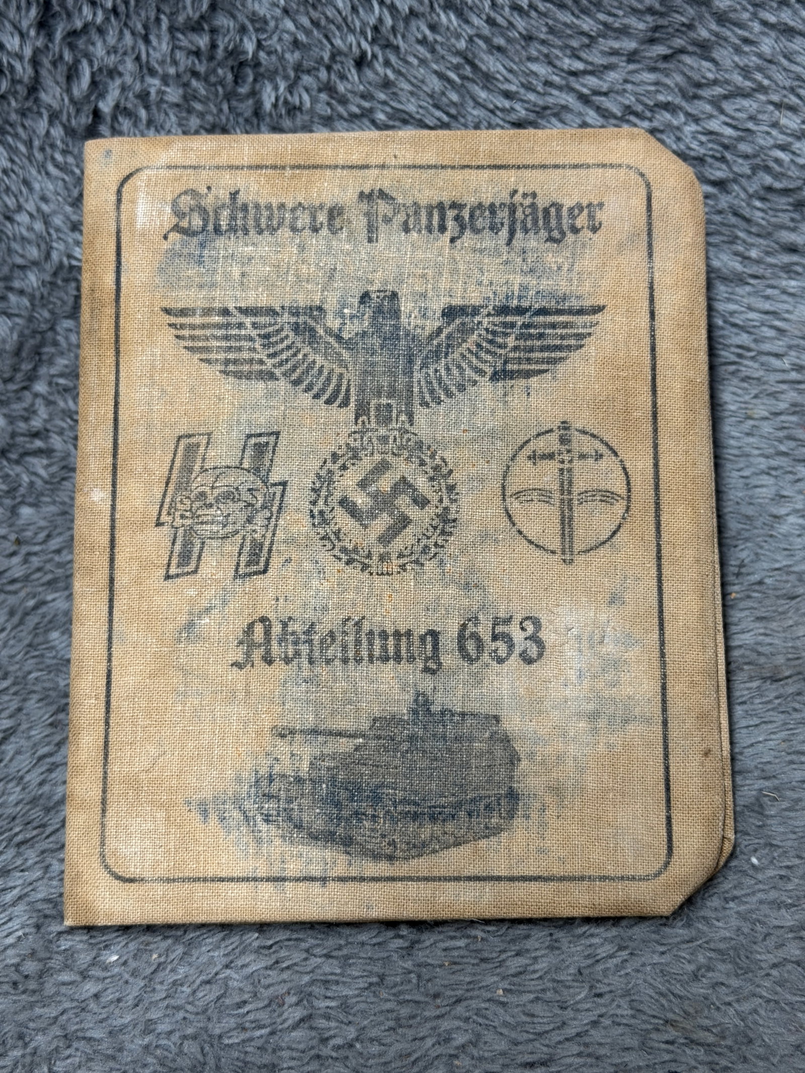 WWII German Schwere Panzerjäger-Abteilung 653 Soldier Identification & Service Booklet: A German WWII-era identification and service booklet prominently marked “Schwere Panzerjäger Abteilung 653,” the heavy tank-destroyer battalion historically associated with Ferdinand/Elefant 