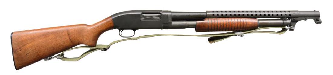 WINCHESTER MODEL 12 ASSEMBLED TRENCH STYLE PUMP: SHOTGUN. Cal 12 Ga., 2 3/4". S# 1892940. Bbl. 20 3/4" cyl. choke marking. Fitted w/ 4 row WWII style handguard & bayonet lug. Mag. tube is standard production style w/ takedown pin & band. Left side o