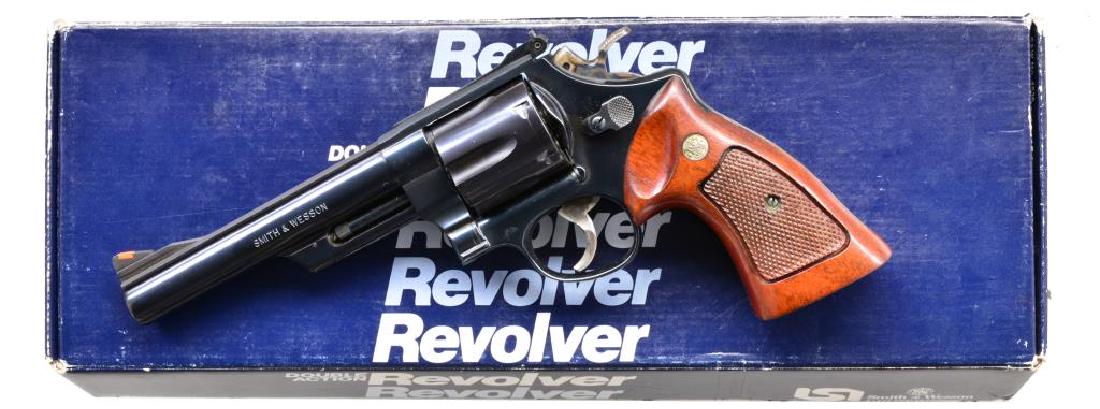 SMITH & WESSON MODEL 29-3 DA REVOLVER.: Cal. 44 Rem Mag. S# AWU5170. Bbl. 6". Full rib bbl. w/ integral ramp having red insert. White outline adjustable S&W rear sight. Blued frame bbl. & cyl. Target hammer, trigger & walnut checkered S&W g