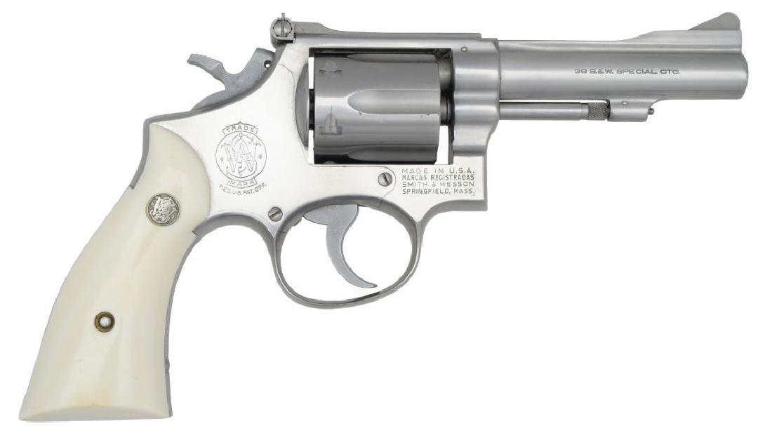 SMITH & WESSON MODEL 67 REVOLVER.: Cal. 38 Spl. S# 3K19733. Bbl. 4" w/ full rib & integral ramp front sight. Standard S&W adj. rear sight. Grips are imitation ivory w/ S&W insignias. 6 Shot cyl. CONDITION: excellent stainless finish mi