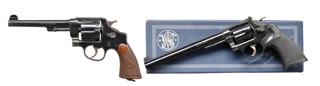 2 SMITH & WESSON DA REVOLVERS.: 1) 44 HAND EJECTOR SECOND MODEL. Cal. 44 S&W Spl. S# 21811. Bbl. 6 1/2" w/ integral semi circular front sight. 6 Shot fluted cyl. 5 Screw action w/ pinned bbl. having lanyard ring at butt. Blue finish