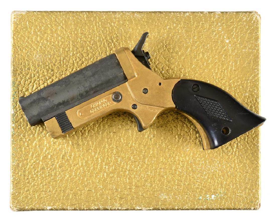 CHICAGO FIRE DERRINGER.: Cal. 22 S. S# A582. Bbl. 2 1/2" four bbl. cluster. Bottom of frame marked "CHICAGO FIREARMS INC., LYONS, IL." Left side marked "CHICAGO DERRINGER." Hammer has rotating firing pin to coordinate w/ the